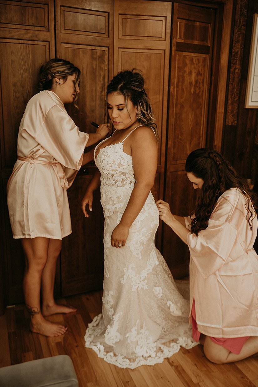  bride getting ready for backyard wedding with bridesmaids 