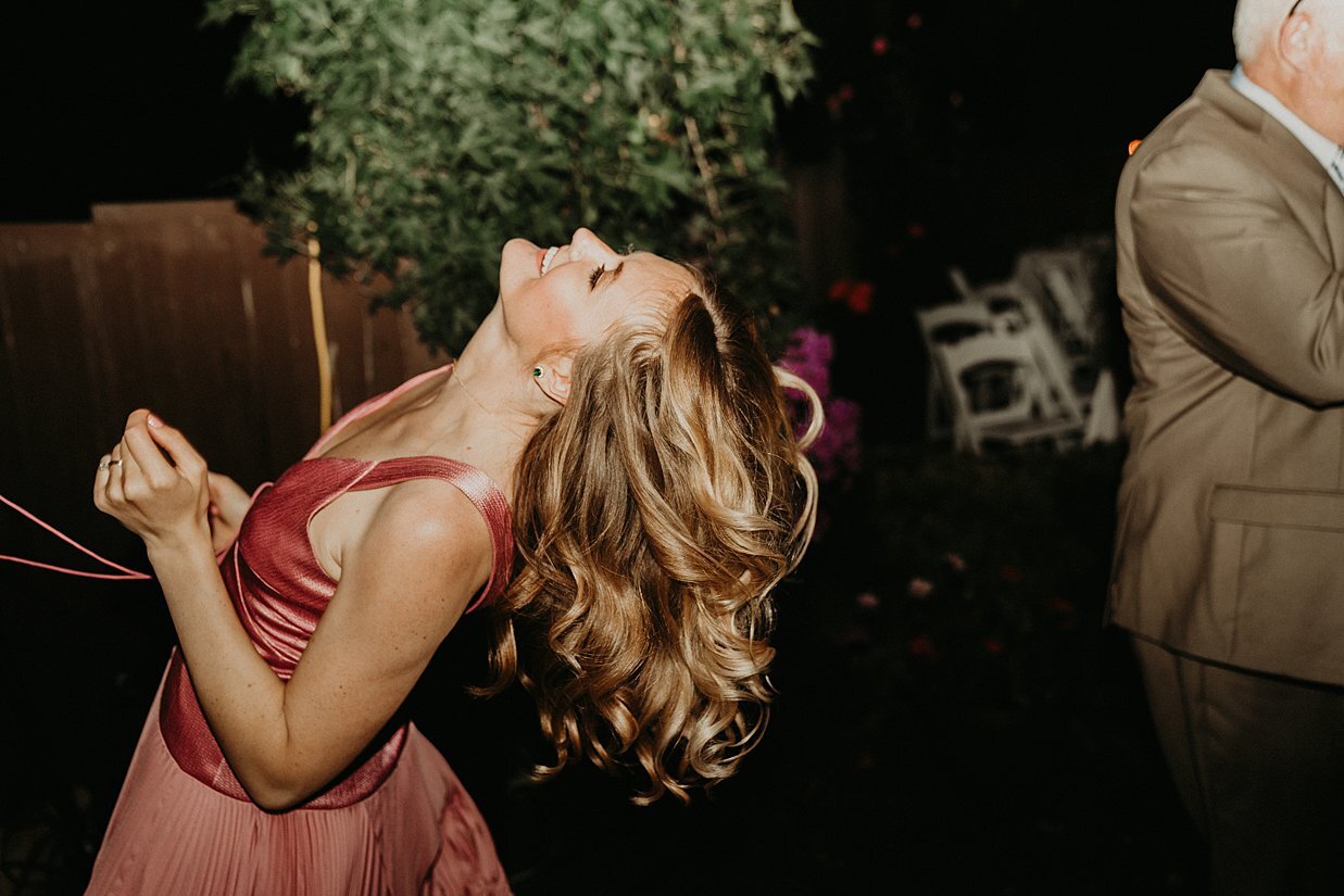  bridesmaid dancing at backyard wedding reception 