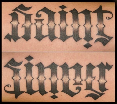 A popular tattoo: the same word reads 'saint' one way, and 'sinner' the other.
