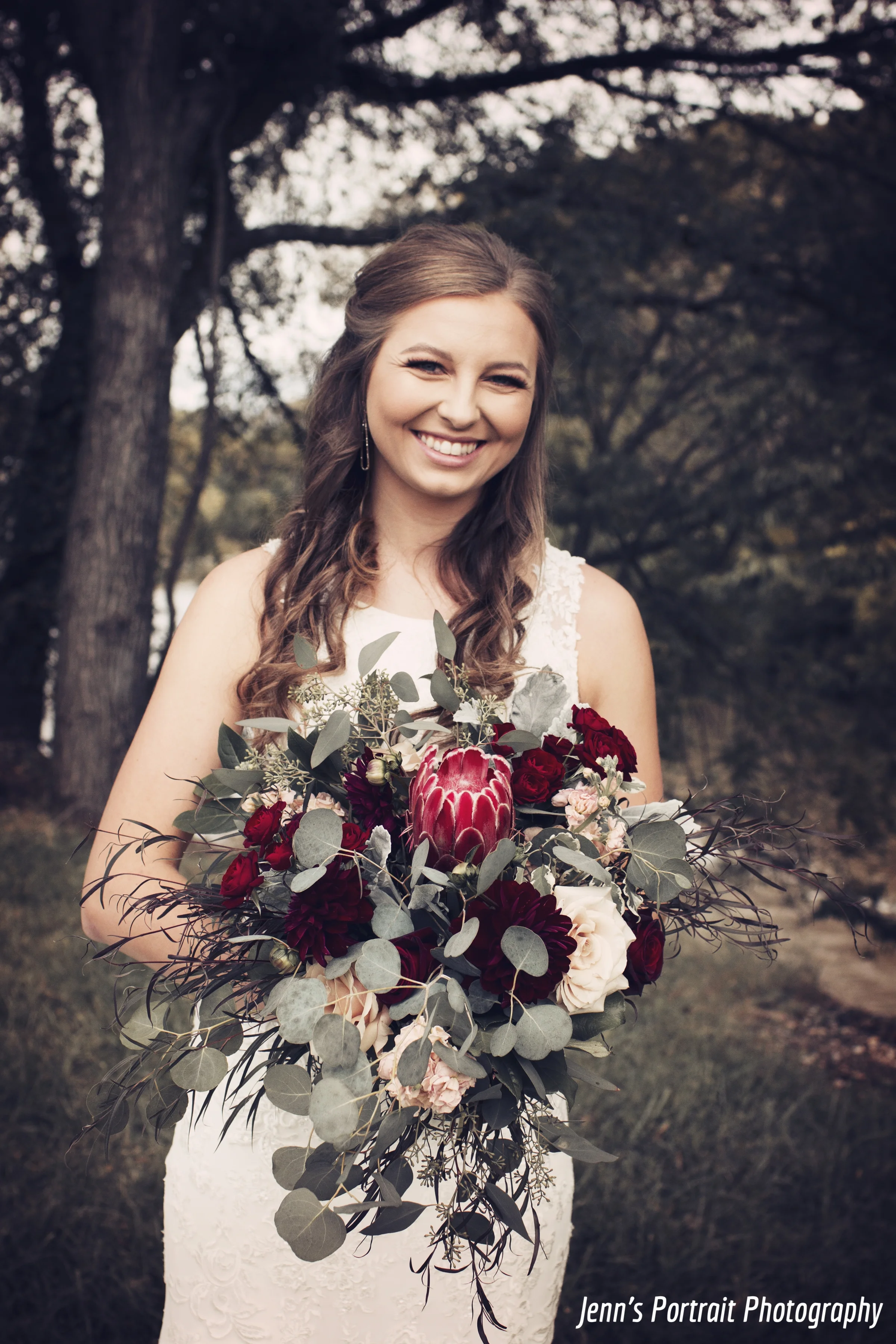 Protea bouquet with mixed greenery