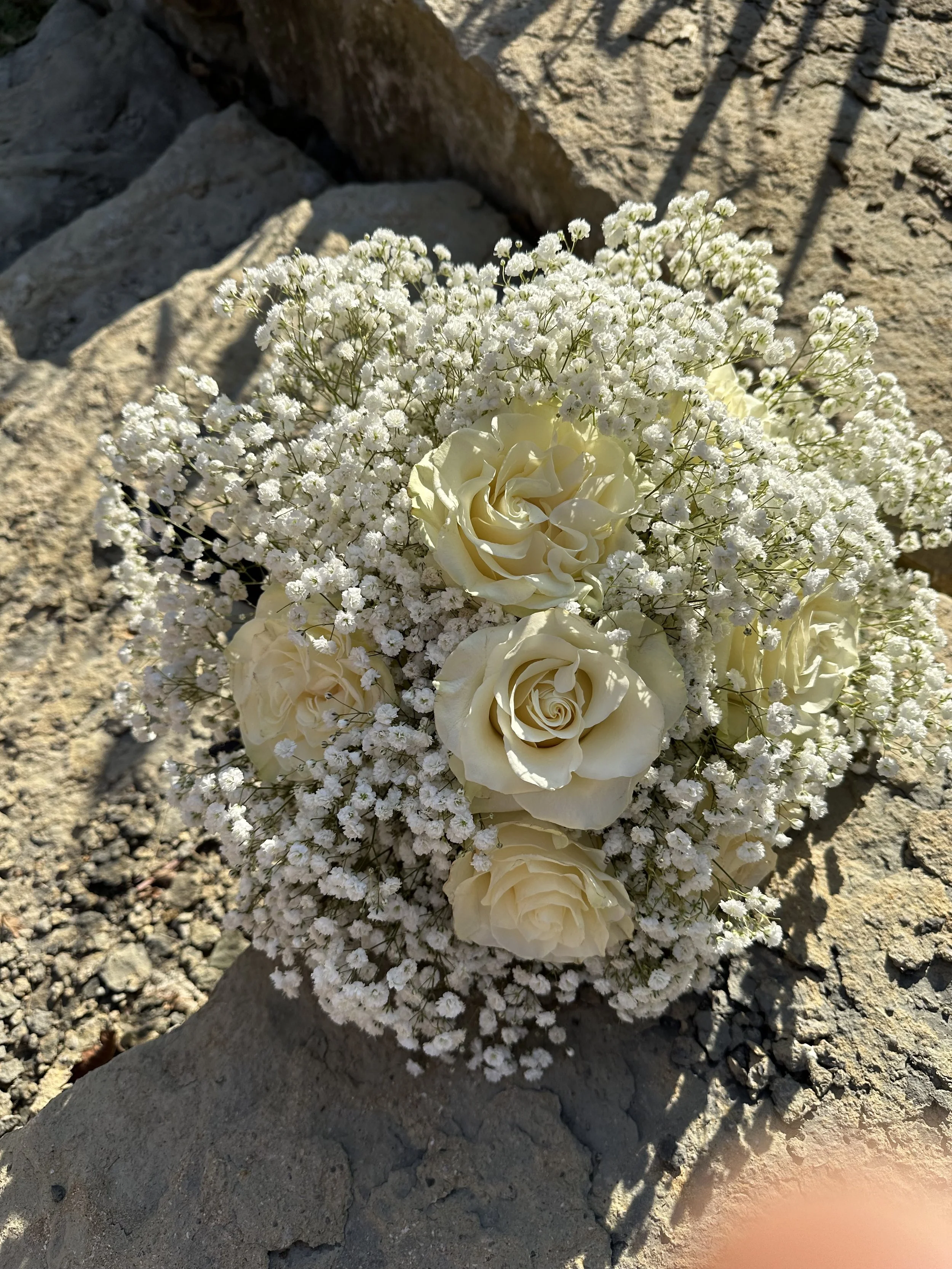 Baby's breath and white rose bouquet