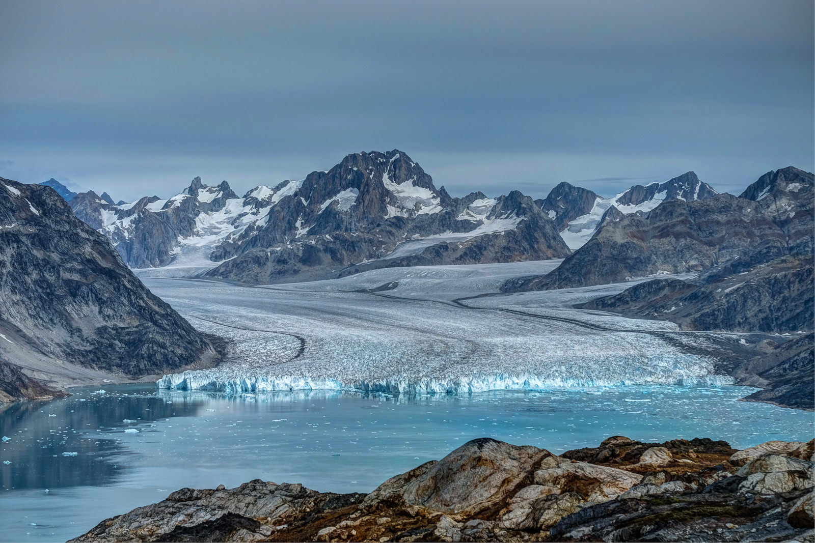 Knud Rasmussen glacier, the magnificent glacier flows into icy waters of Karale fjord, East Greenland. The glacier is named after a similarly magnificent man, Danish polar explorer Knud Rasmussen
