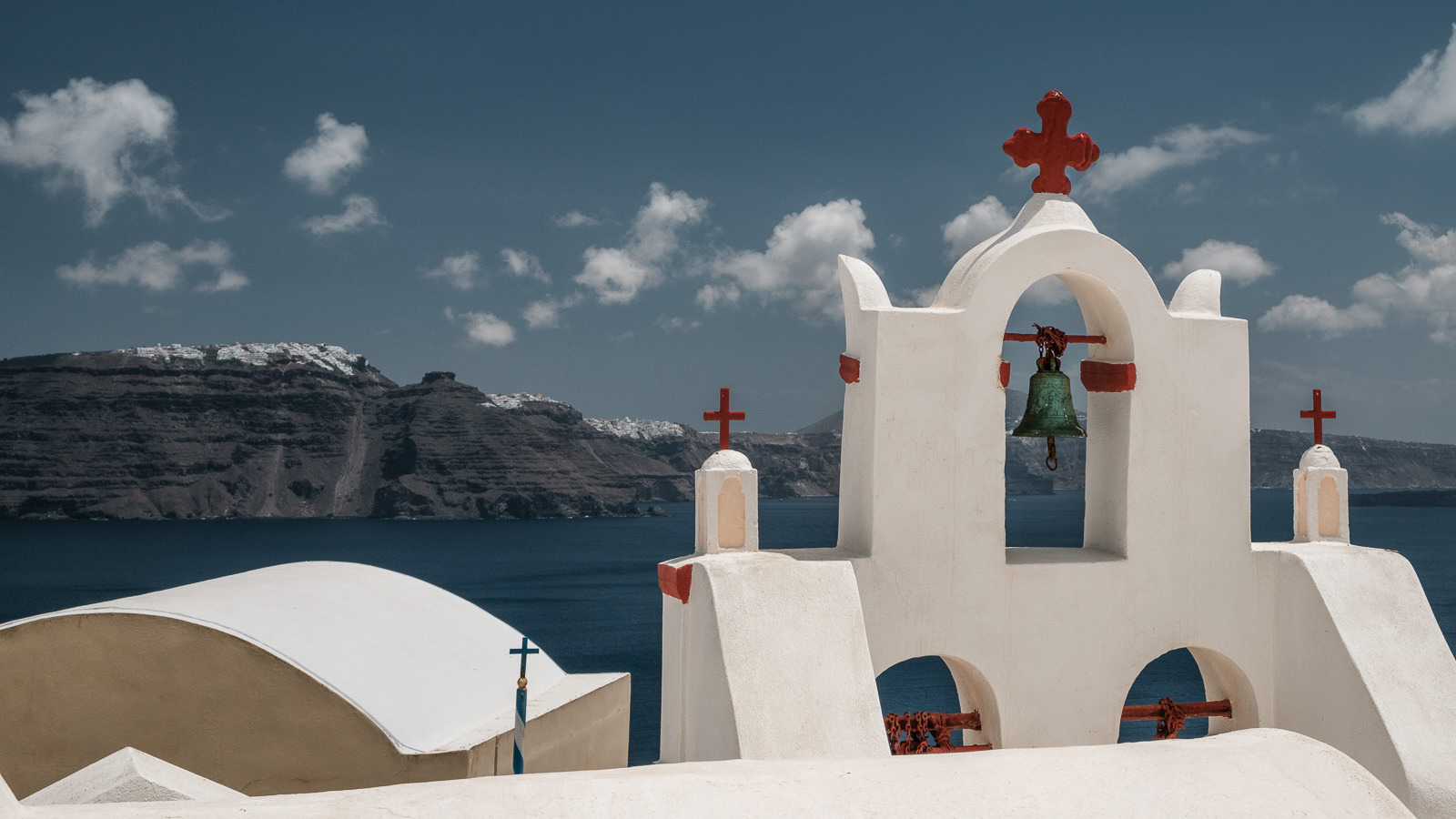 Church in Oia and view towards Imerovigli and Fira