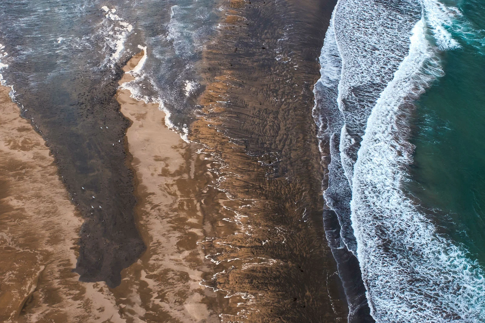 West Iceland coast line from above, shot taken from a small airplane (Cessna). A few flying birds on a left side for scale. (XF 16-55mm f2.8 at 22mm 1/1000 f4.5 ISO800)