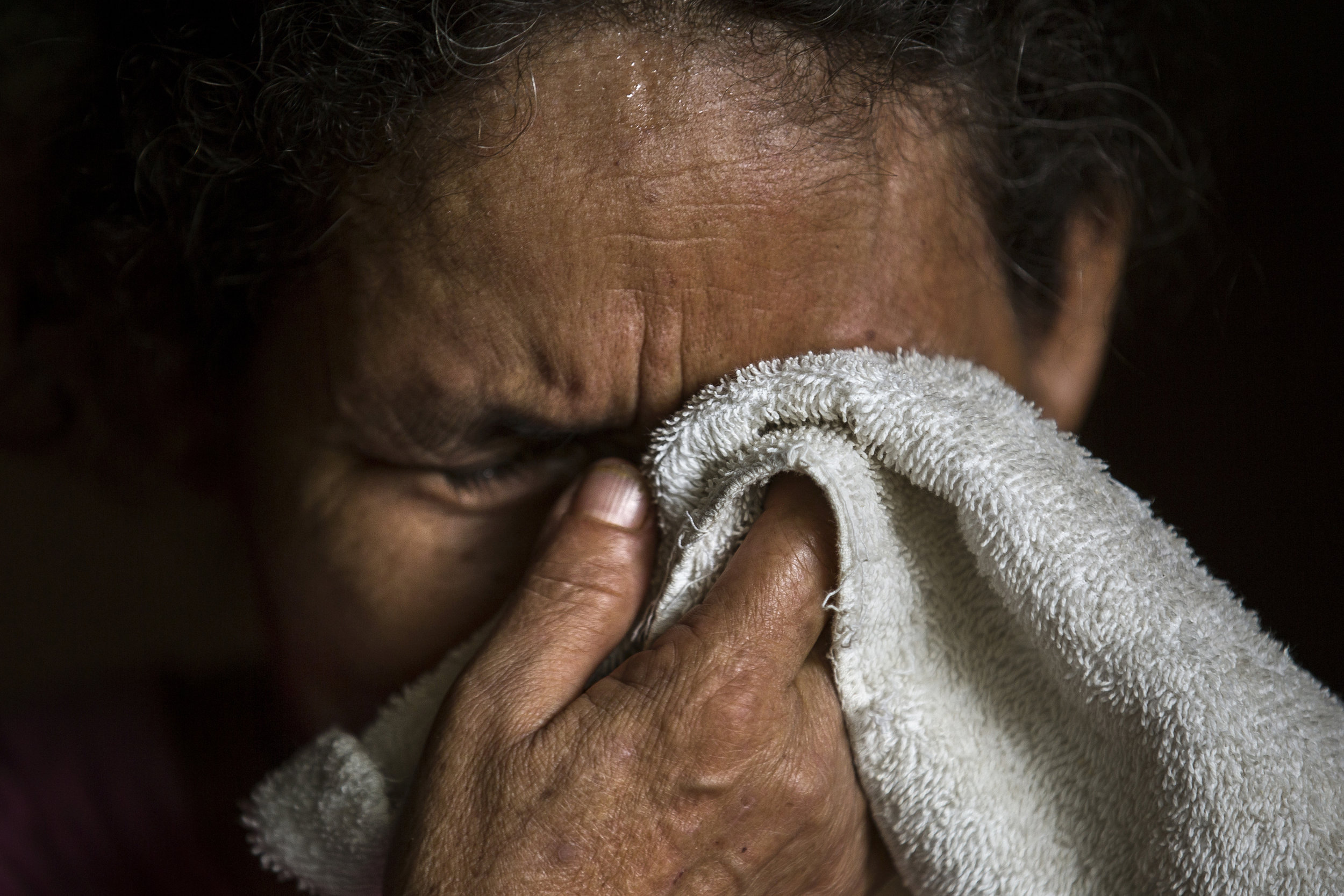  SAN HILARIO, EL SALVADOR. Maria Leoneor Arevalo Romero cries while thinking of her two sons Ernesto de Jesus Arvelao Medina, recently killed by gang members in their hometown of in San Hilario in El Salvador, and Jose Adrian Zamora Arevalo who was d
