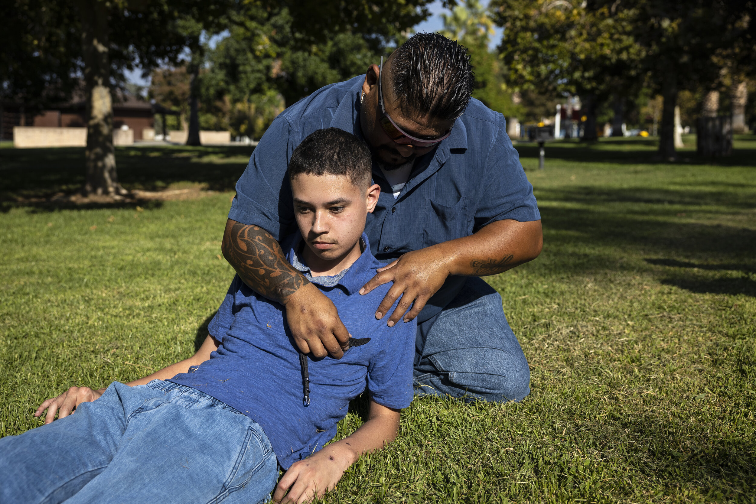  Gabriel Martinez uses a vagal nerve stimulator to short circuit a seizure of Ethan's that occured while the two were playing catch at Brookside Park in Redlands, California. 