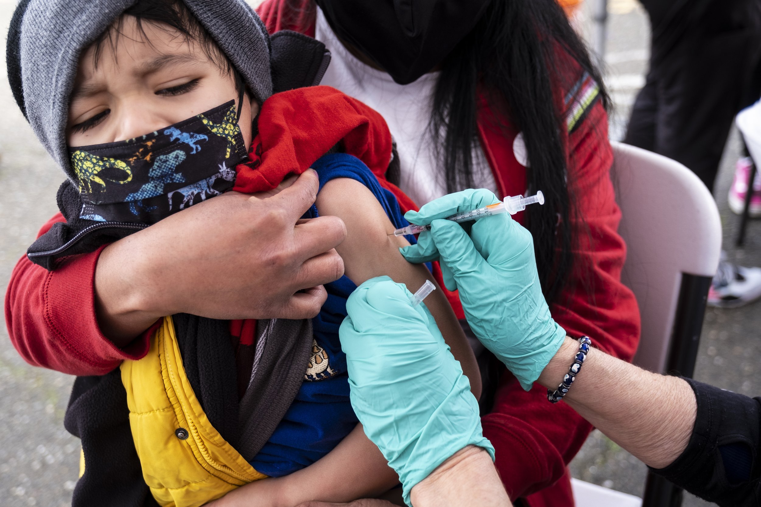  Ariel Garcia, 5, receives a COVID-19 vaccination at the La Clinica de la Raza community vaccination site in Oakland on Jan. 4, 2022. Martin do Nascimento/CalMatters 