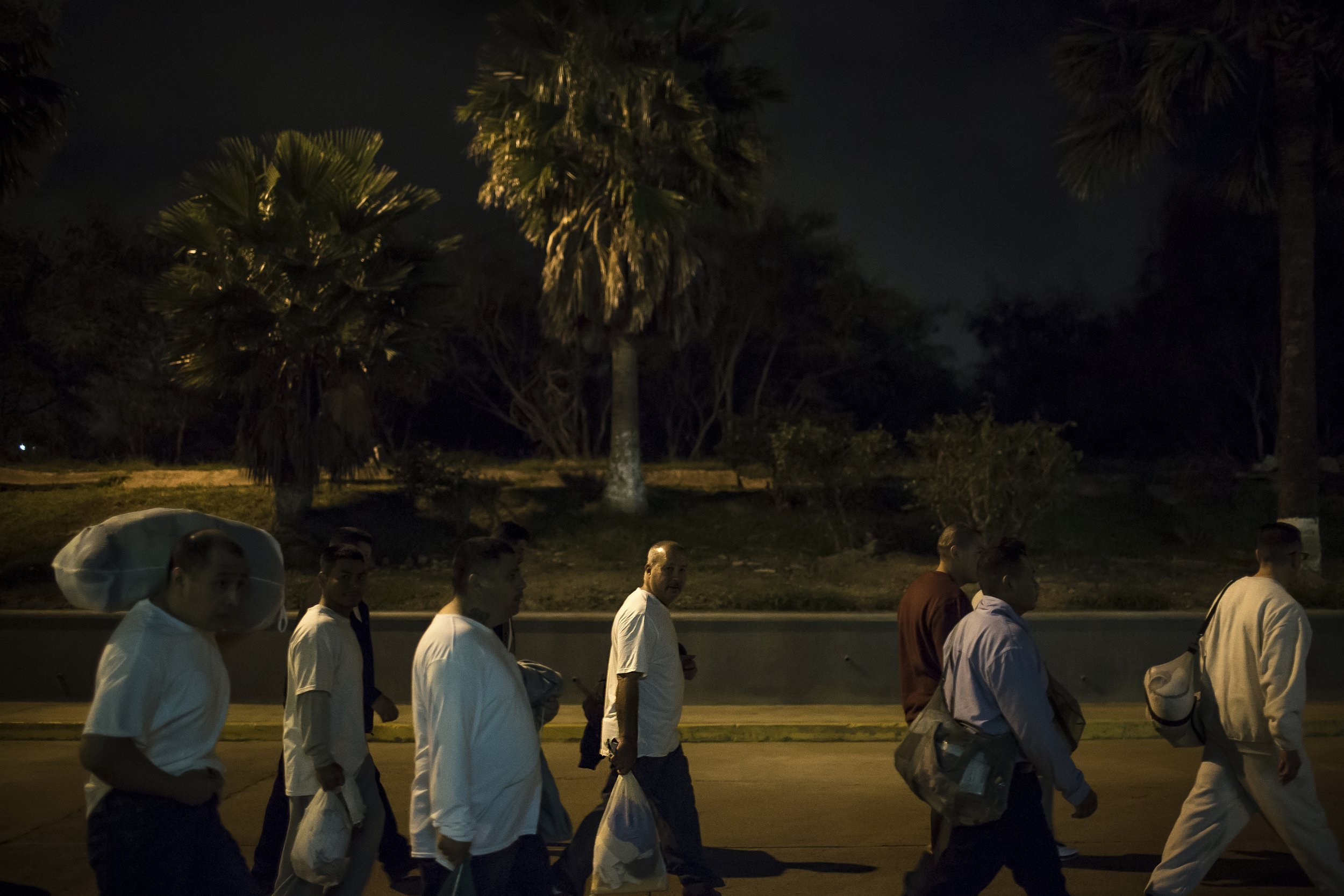  A group of undocumented Mexican national ex-offenders enter Mexico at the US-Mexico border crossing at Brownsville/Matamoros after being deported from the United States on Nov. 4, 2015. Photo by Martin do Nascimento 