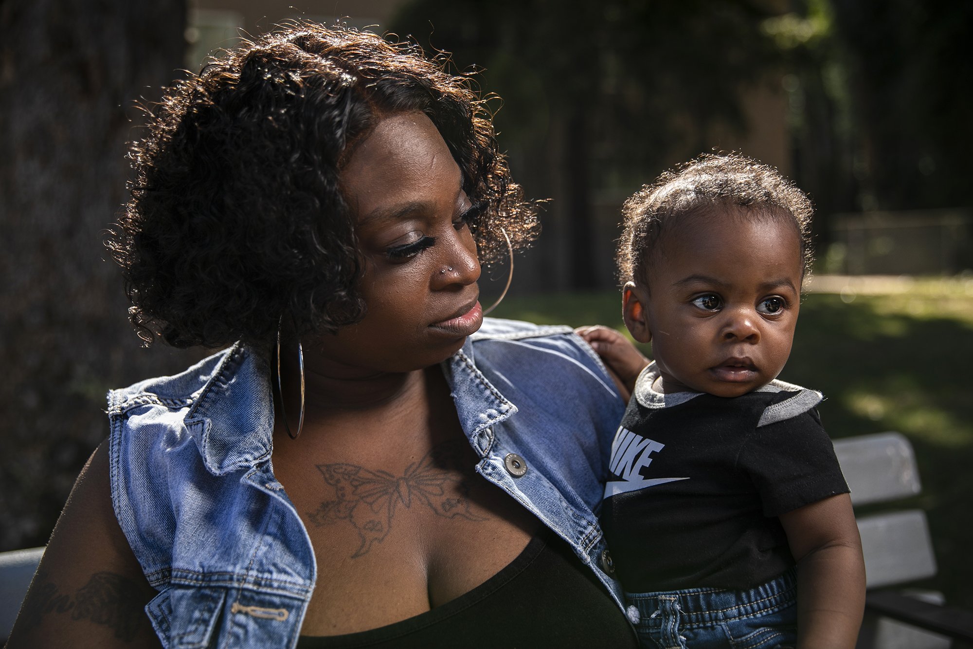  Starlyn Darby and her 8-months-old son Zelimir Quarles are photographed at Memorial Park in San Leandro on June 14, 2022. Photo by Martin do Nascimento, CalMatters 