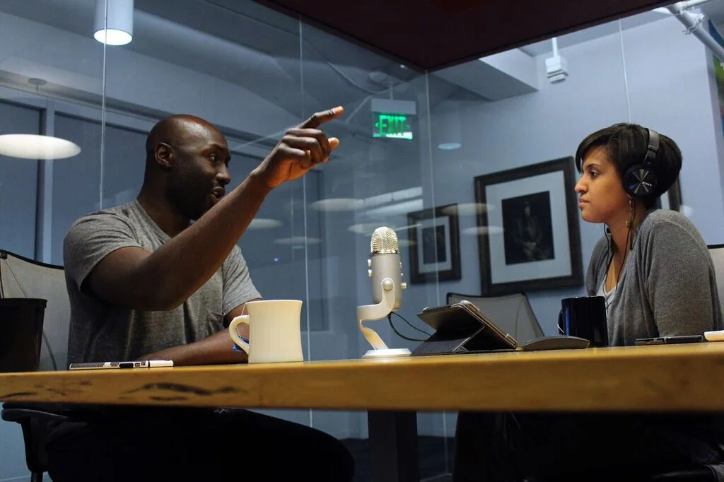 Malcolm and Alexis discussing Boston