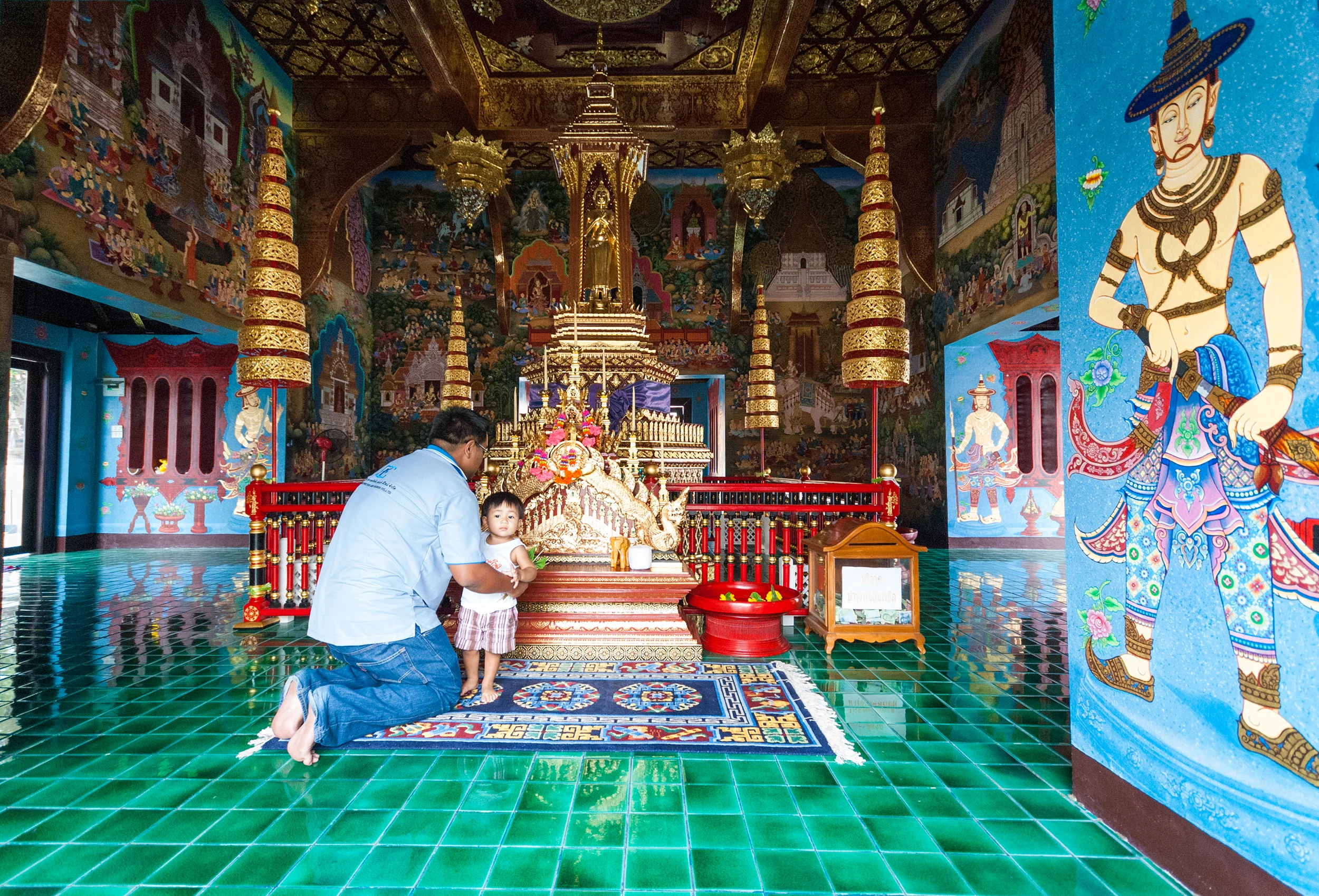 In Wat Chedi Luang temple complex, there is a temple where only men enter, where fathers take their sons to pray. Chiang Mai, Thailand
