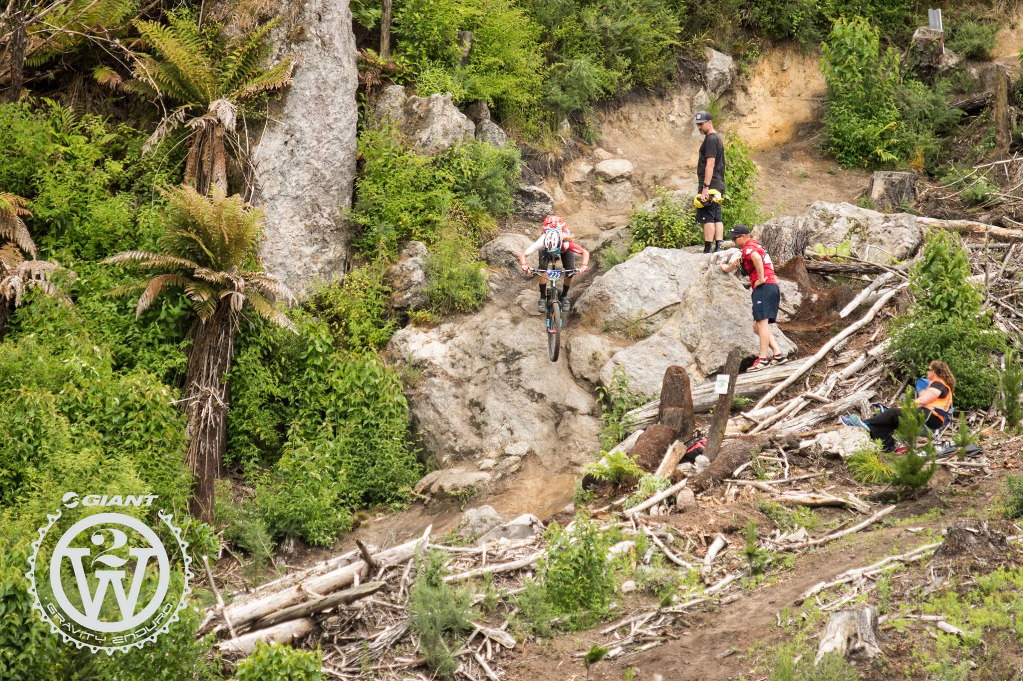 Rae Morrison dropping over the boulder, Boulderdash Trail.