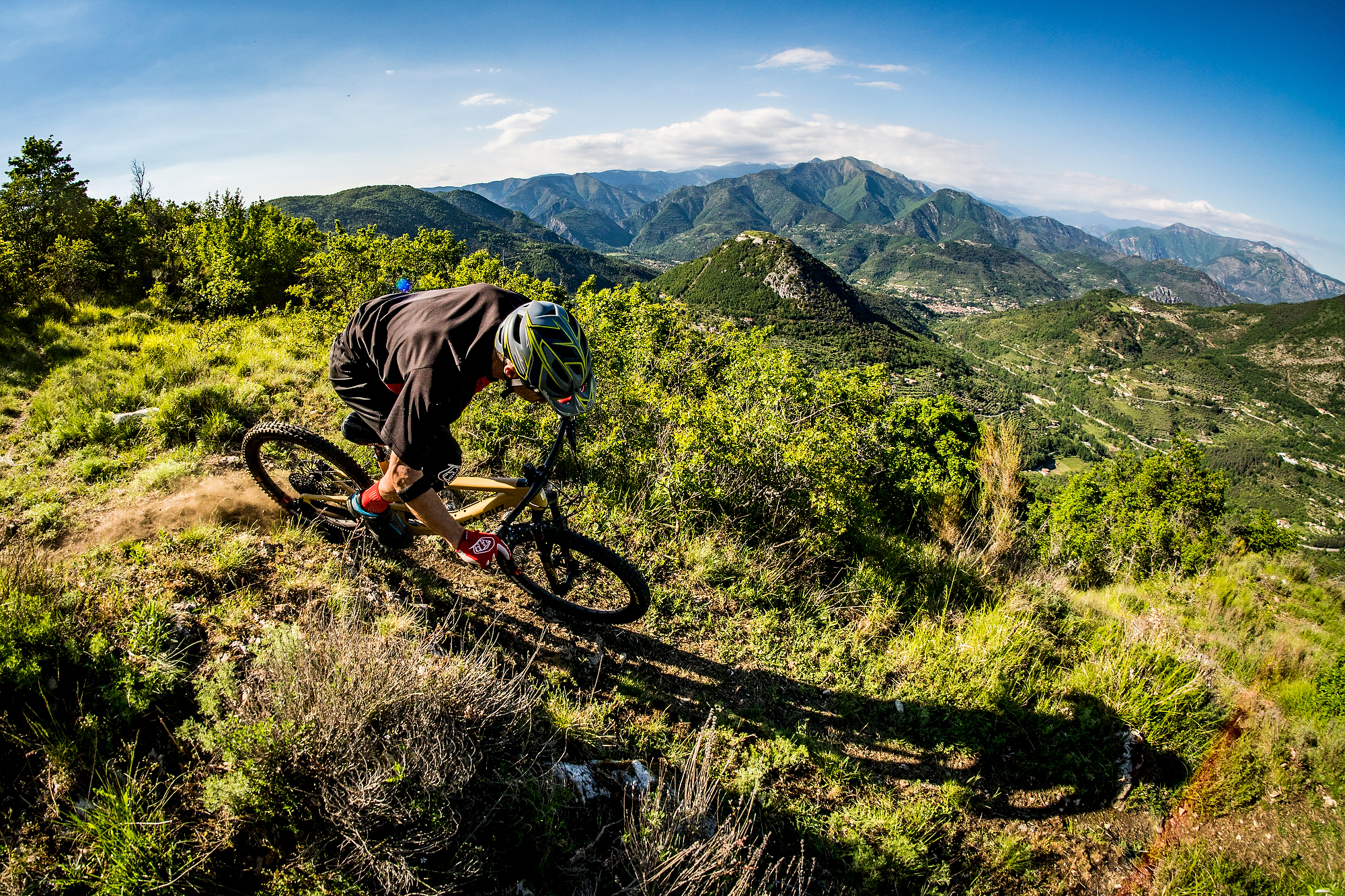 Occasionally I had to stand up and pedal during the hour long descents into the valley floors. photo: Sven Martin