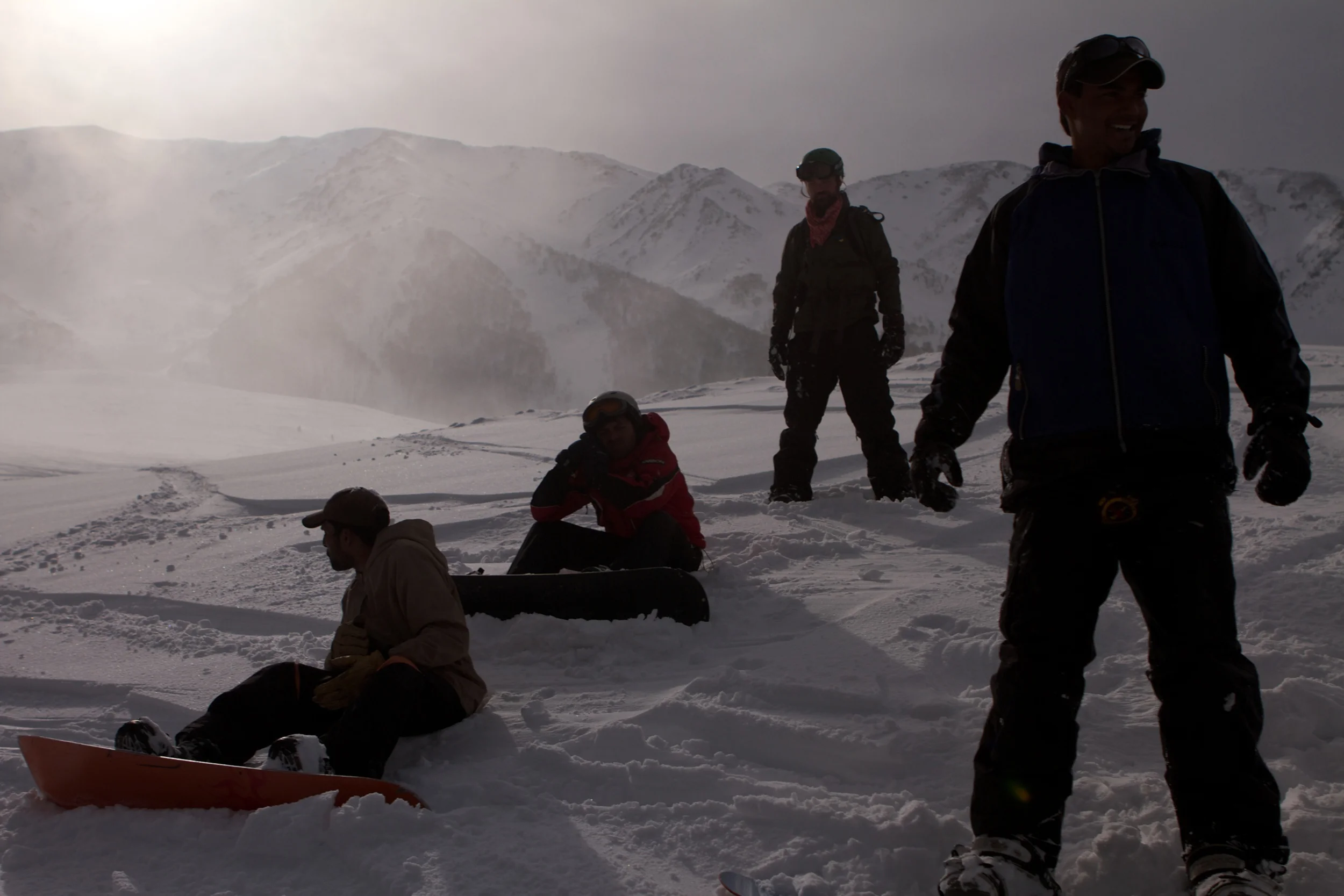 A crew of friends finishing a day on the hill as the sun gets low over Mt Affarwat.