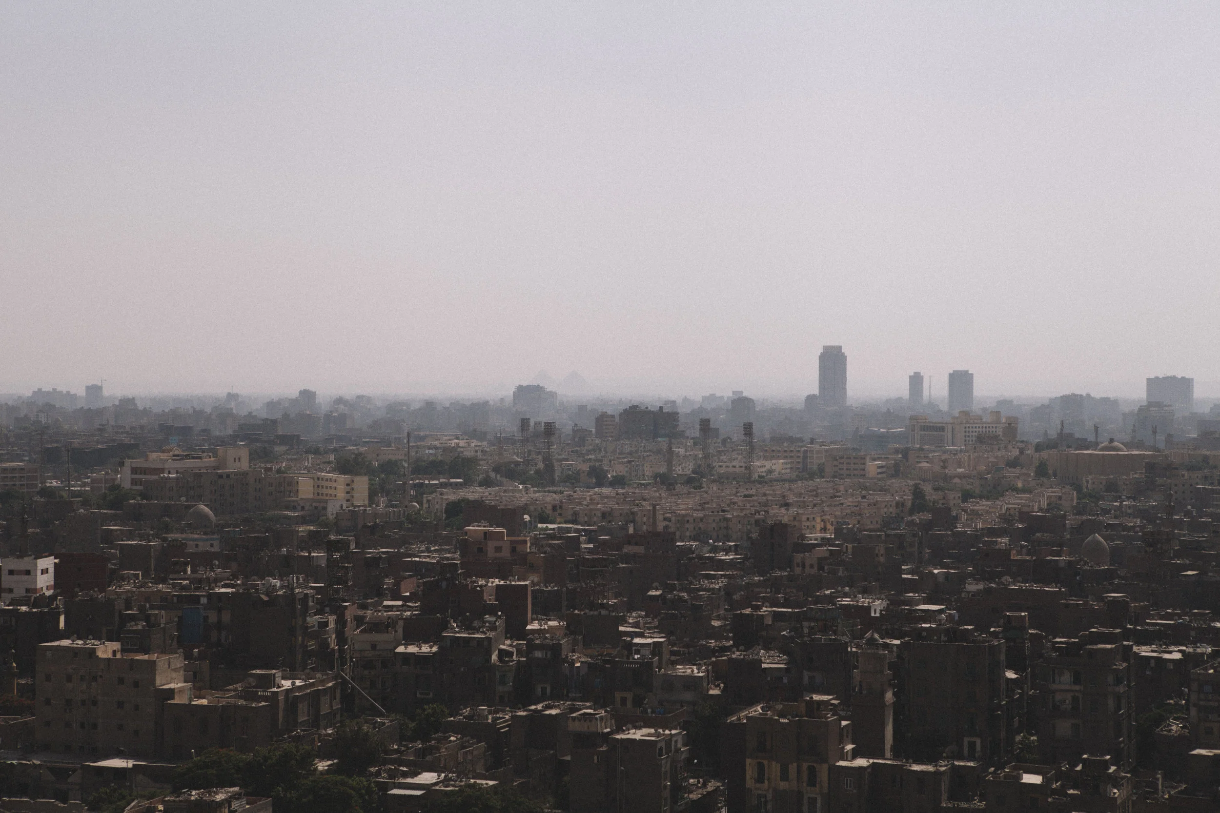 If you look closely, you can see the pyramids in the background. 