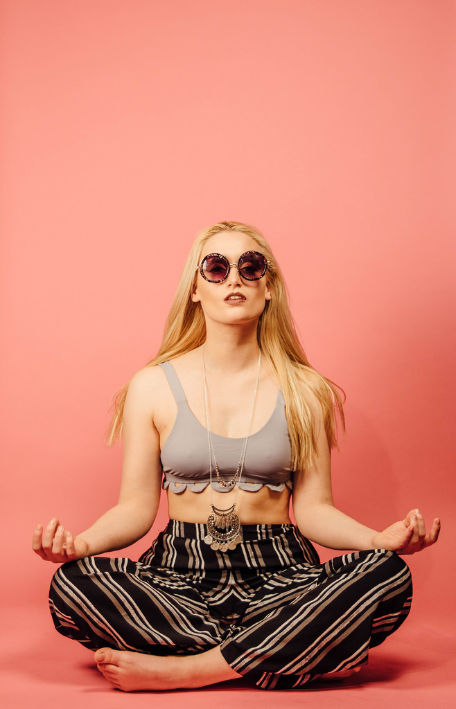 Melanie is wearing the Ali Top in Smoke by Mandalynn Swim. 