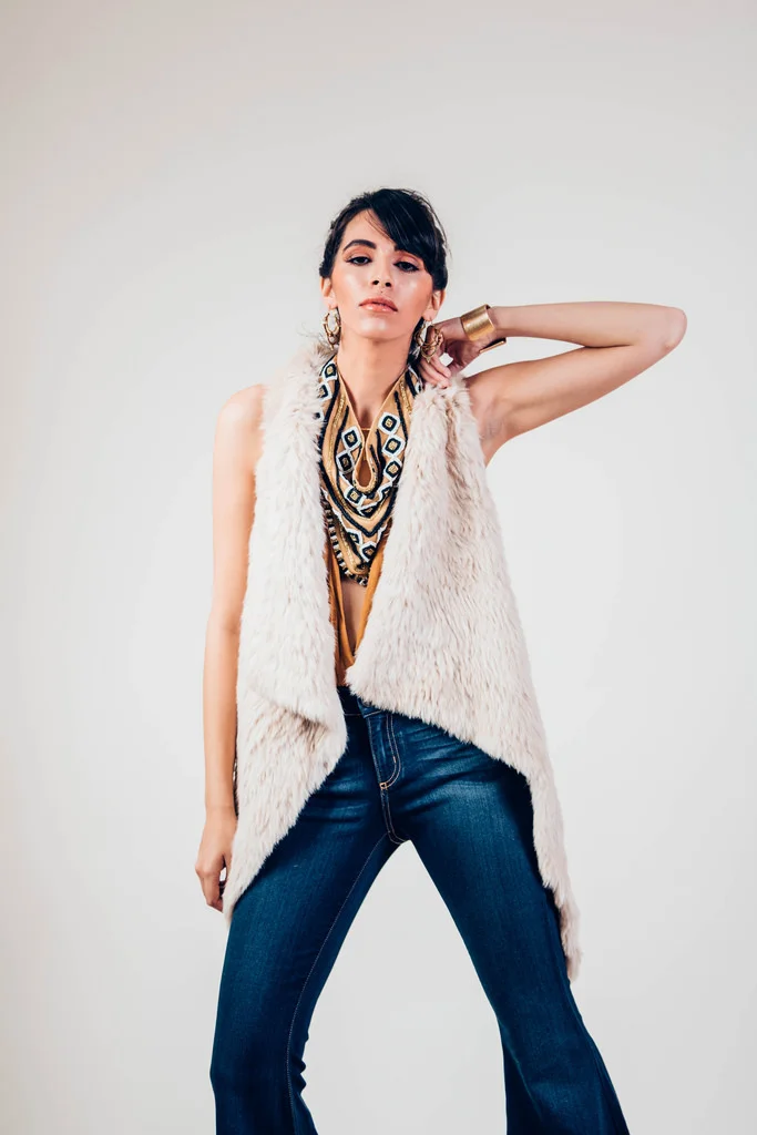 Ella Denim Super Flares by Free People. Suki Embellished Bandana by Free People. Halter Low-V Bodysuit in Honeycomb by Free People. Beige Rabbit Fur Vest by Jocelyn. 