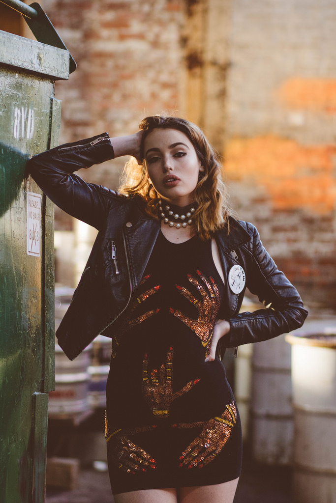 Black dress with sequins: Discount Universe. Choker by Mason Beretta. Black biker jacket: Stylist's own. Ankle boots: Zara. 