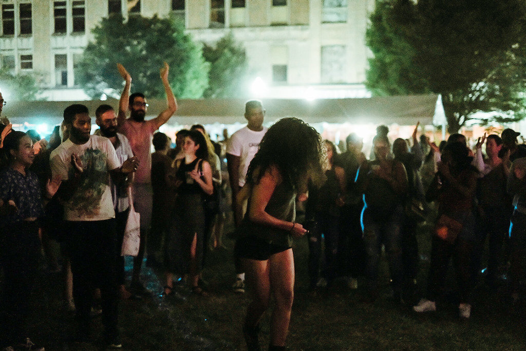 People dancing to the DJ set at the main stage. Photo by Joe Portugal.