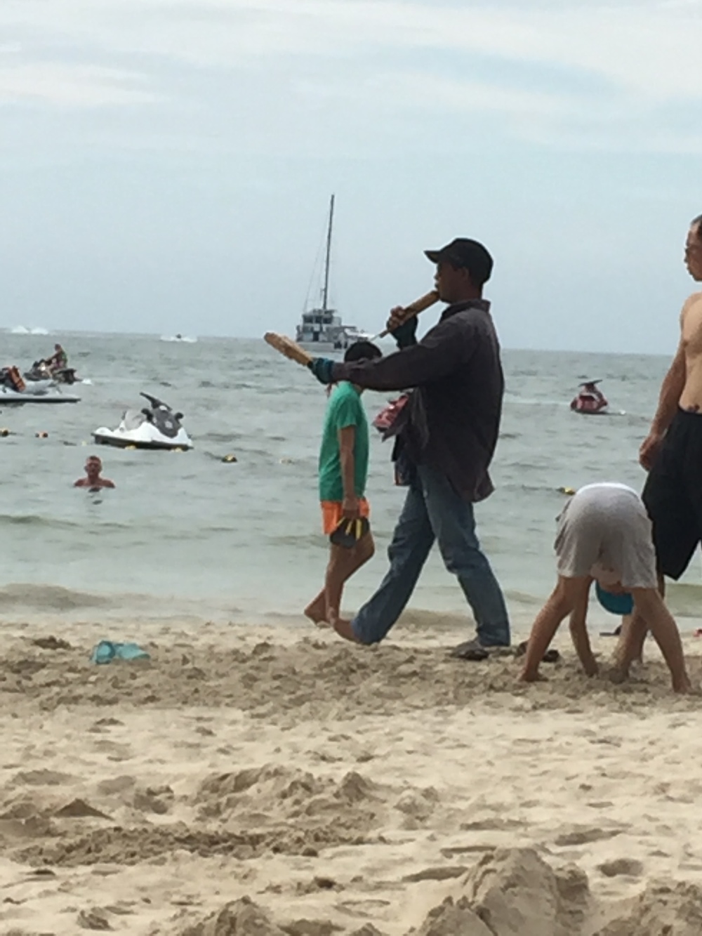  Selling stuff on the beach. These flute things sounded cool, but don't make eye contact or he'll think you want one. 