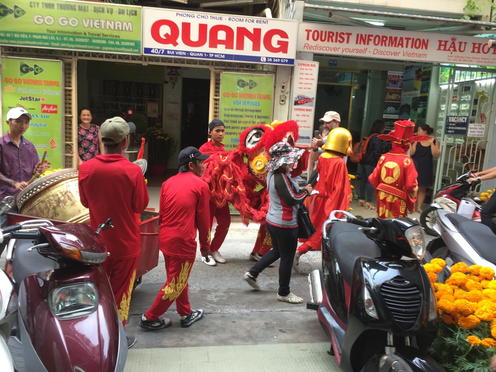  Costumed drummers making a ruckus (for the new year holiday I assume) 