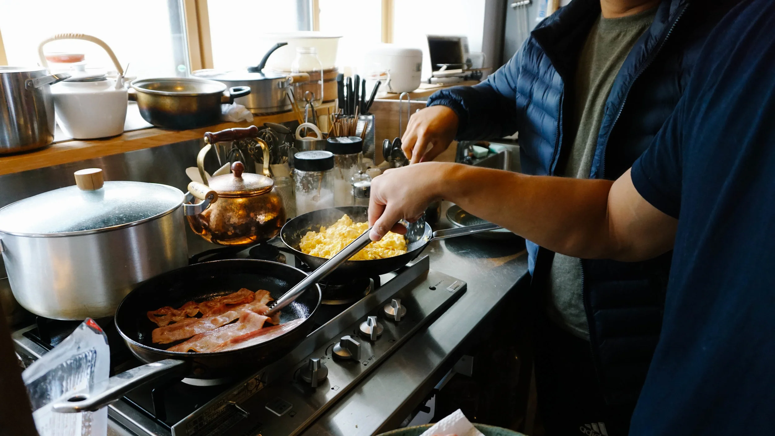 The boys making breakfast Ron Swanson style -- good ol' fashioned bacon and eggs. 