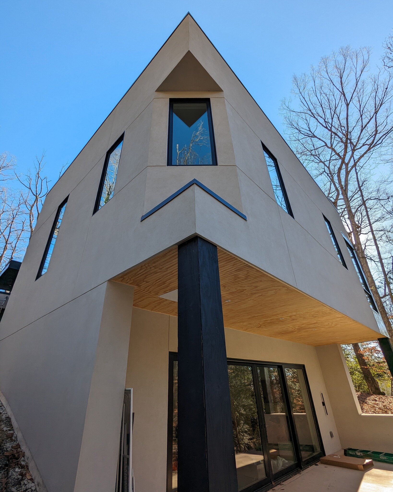 The final touches are coming together at the Hillside House! Nestled in the landscape, the elevated living area offers views into the surrounding tree canopy. The interior features natural wood finishes, which create a connection to its surrounding e