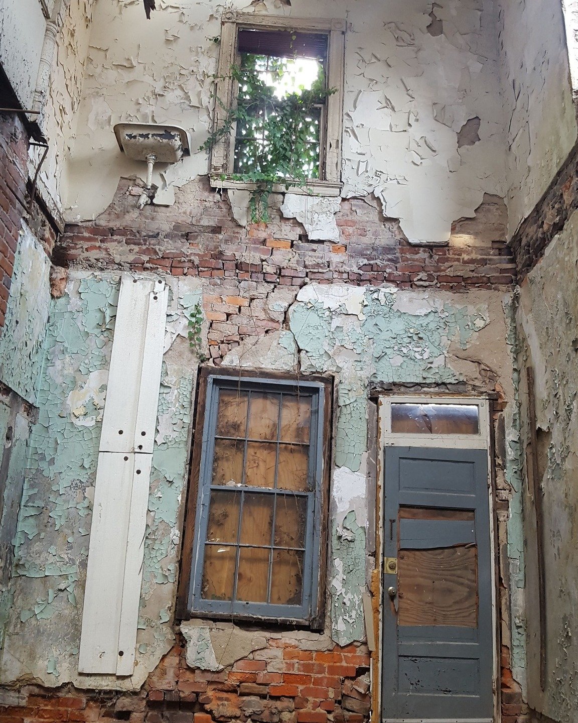 A remarkable look back at a project from 2016. It took heroics to salvage the 1895 Queen Anne row house; the entire roof had collapsed into the lower floors and the rear of the building suffered massive damage. Brick by brick, the rear and side walls