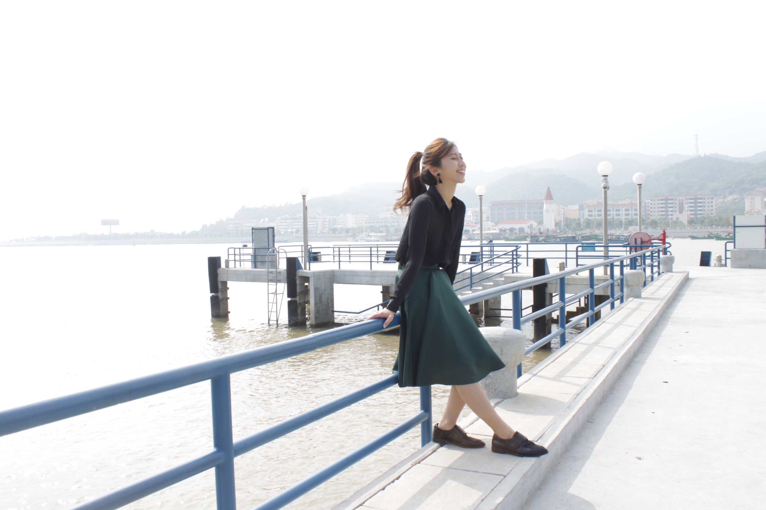 H&M black sheer blouse / Amber (HK) green midi skirt / Vanishing Elephant black pony hair loafers / DearPostman black tassels earrings