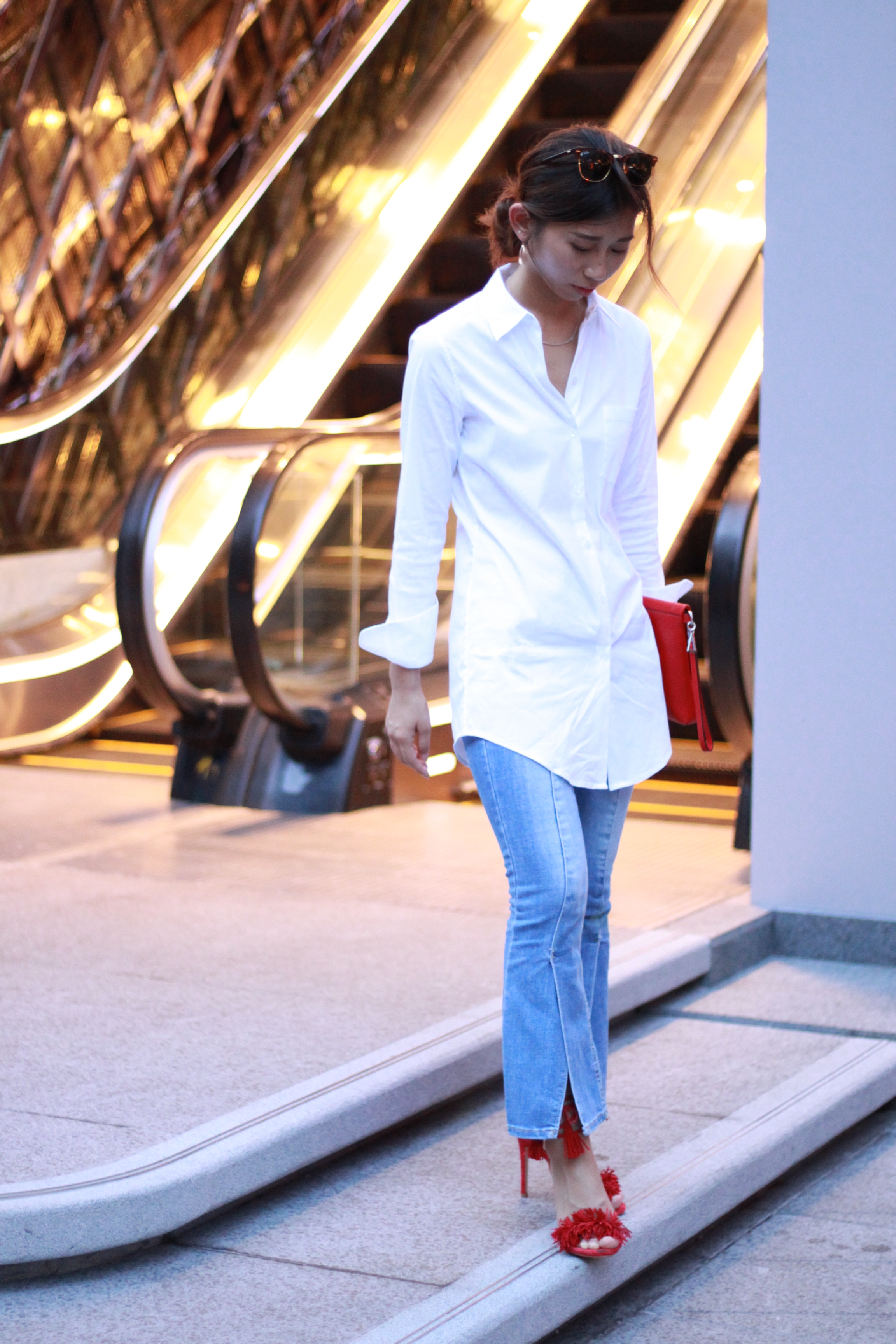 Theory white shirt / Amber flared jeans / Steve Madden red open toe pumps / Agnes. b red foldover clutch