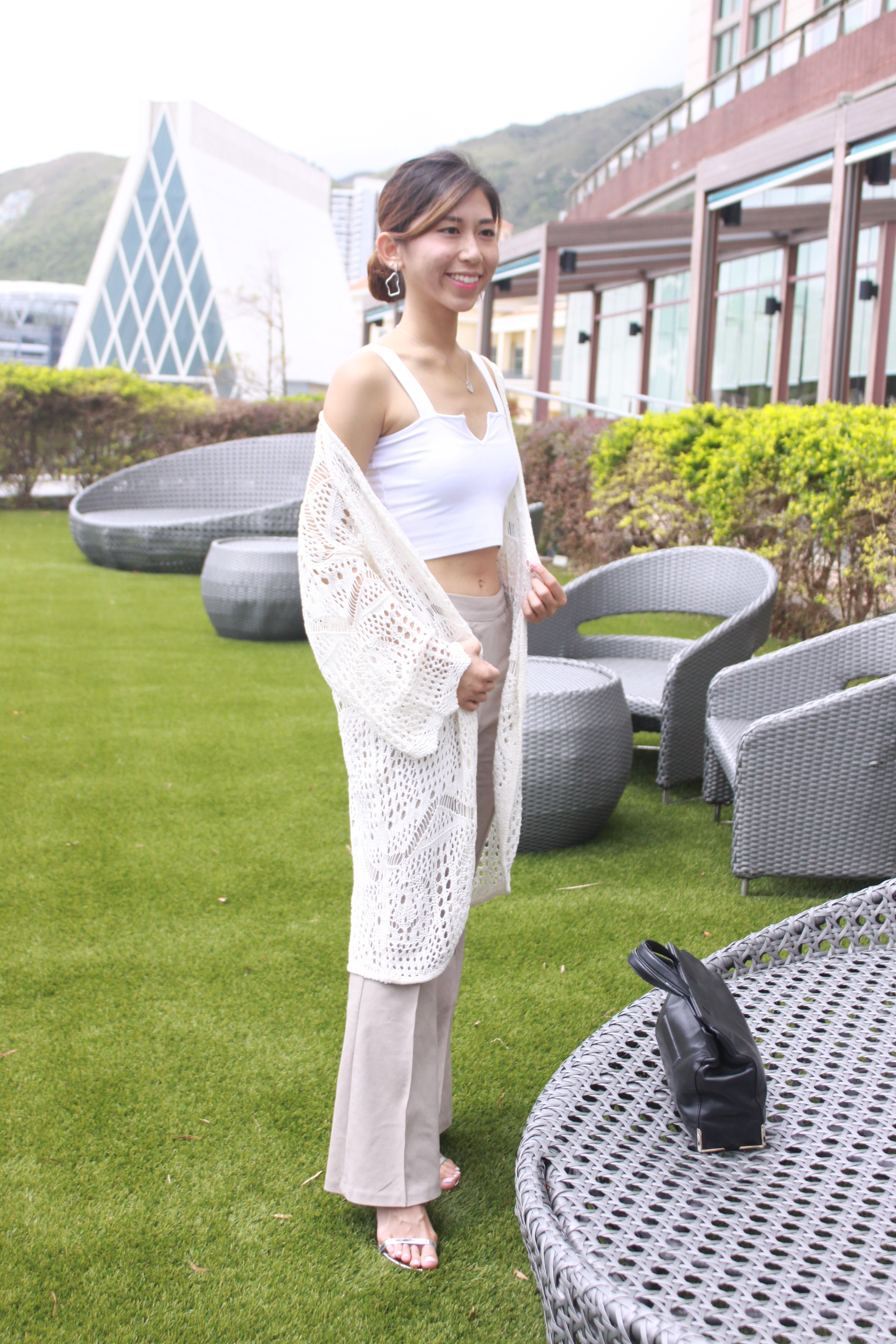 Brandy Melville white top / StudioDoe beige flared pants / Stuart Weitzman nudist song tin glass microfibre sandals / Fashmob cardigan / Alexander Wang handbag / StudioDoe irregular earrings