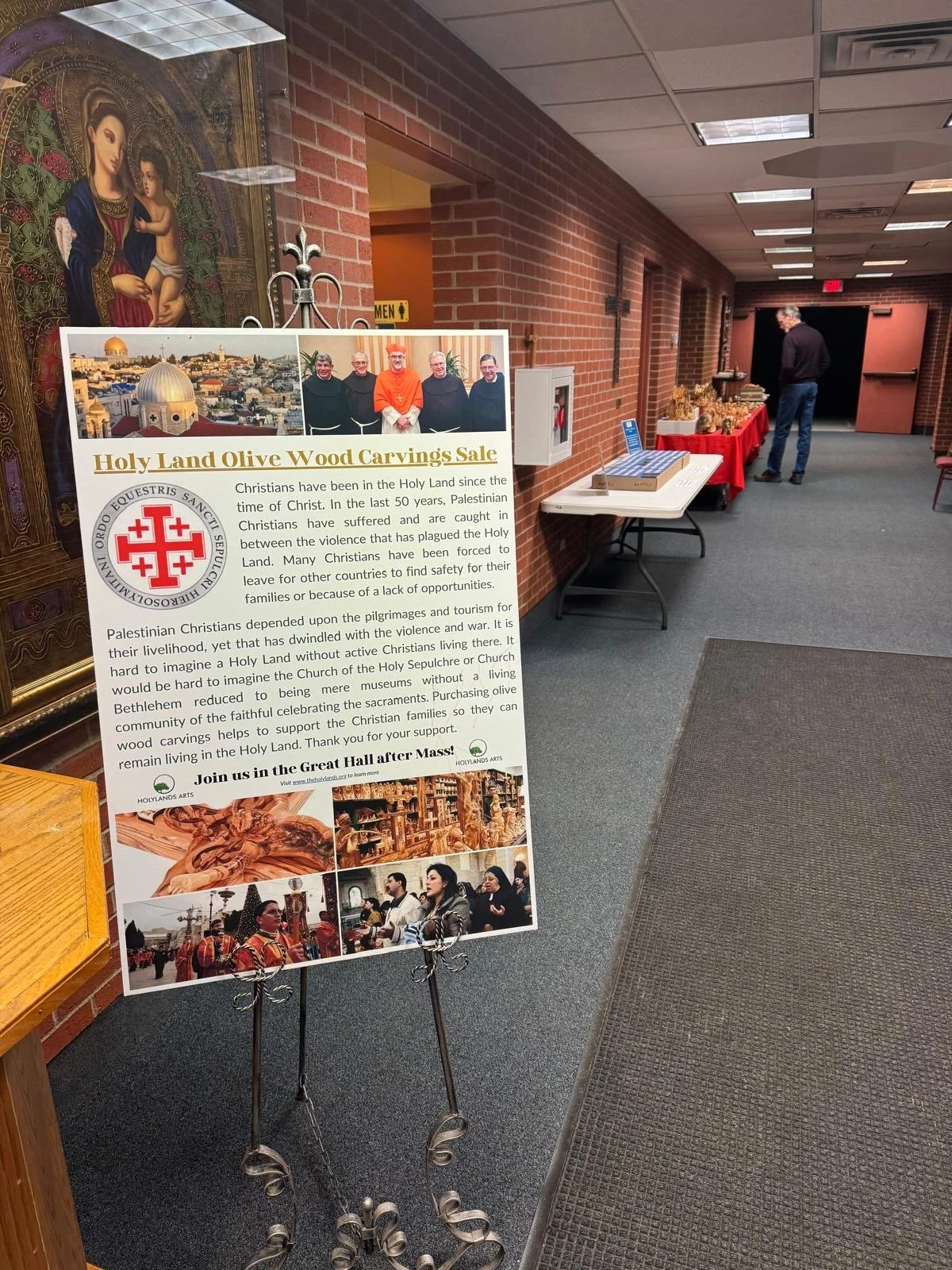 Holylands Arts display in a parish hallway after Mass