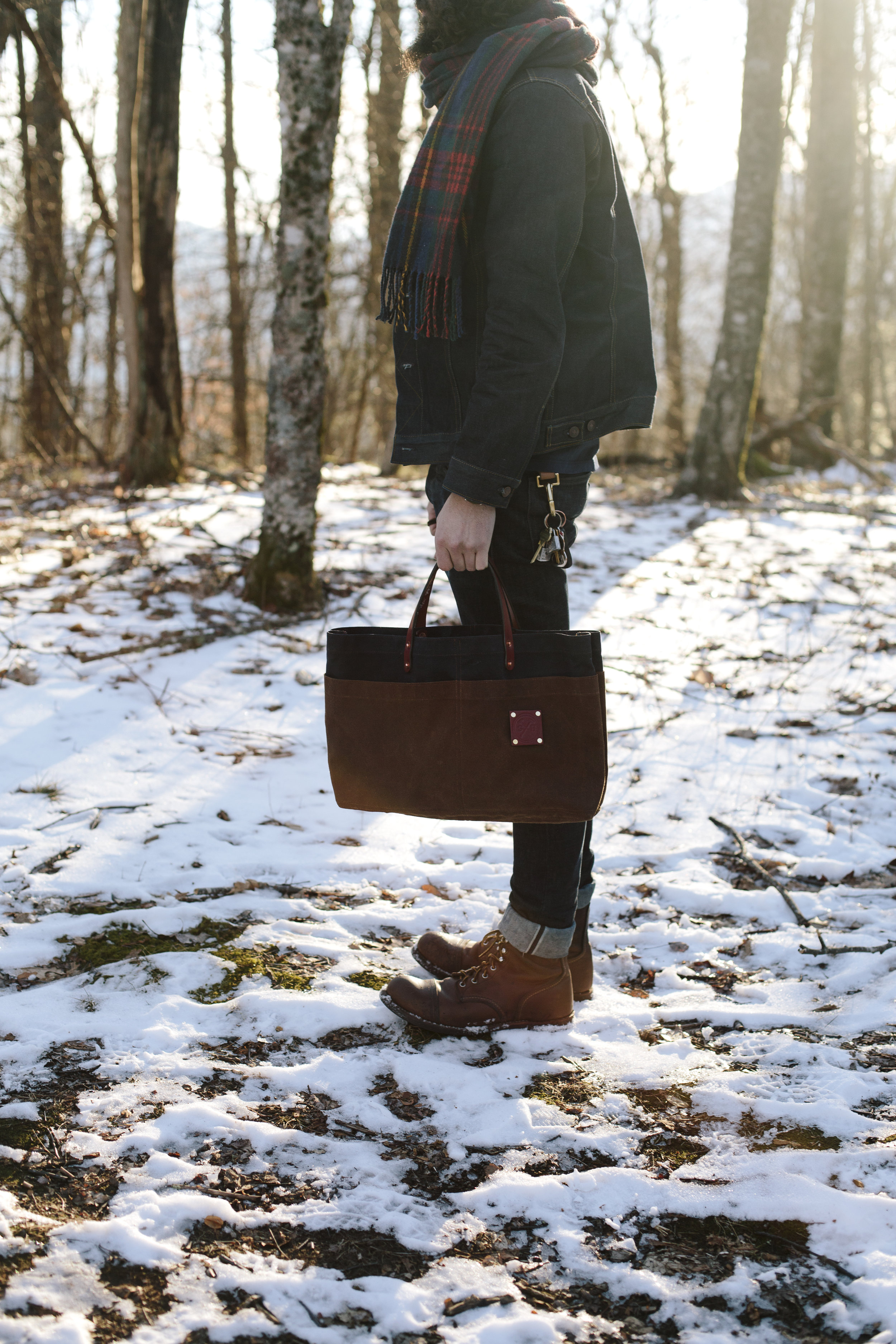Man Carry in the snow Sturdy Brothers Waxed Canvas.jpg