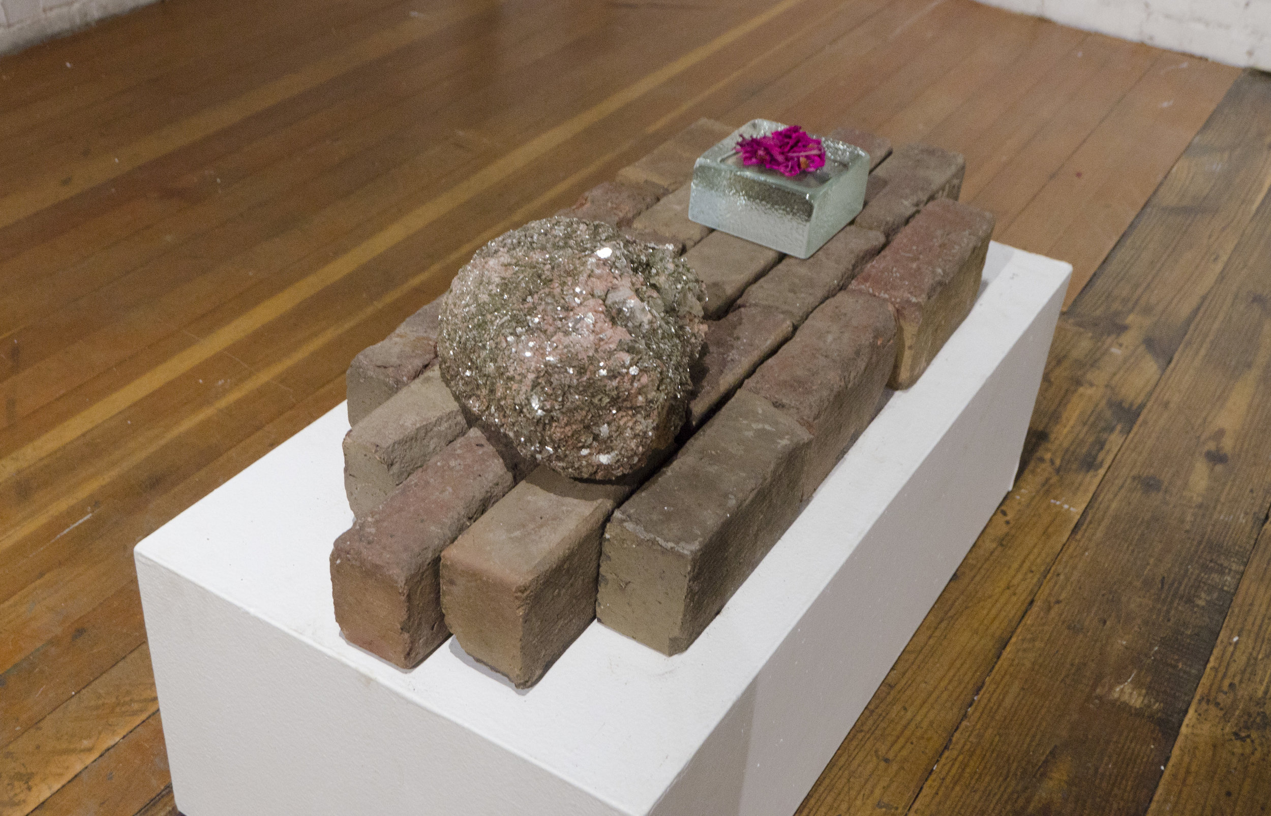   Multi-Faceted    2018   Brick, glass, dried flowers, and fool’s gold    