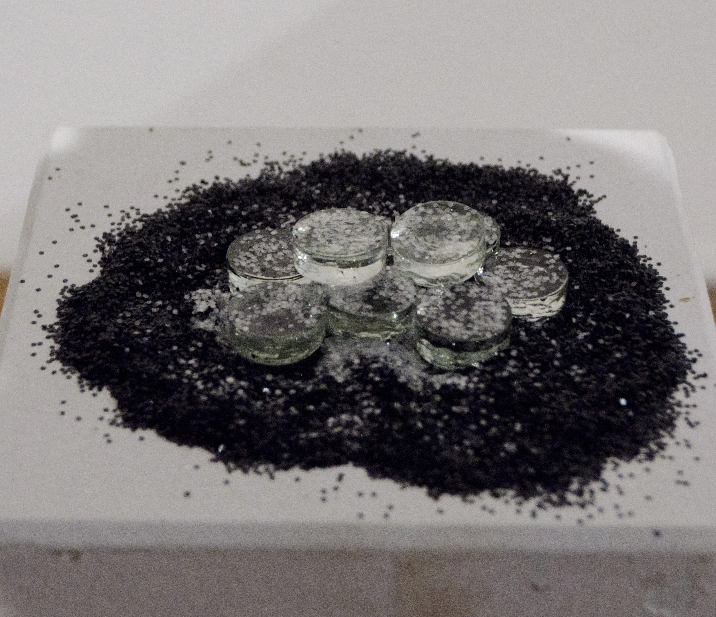   Ever changing walks  (Detail)   2018   Spray paint on mesh, with brick, glass, and glitter 