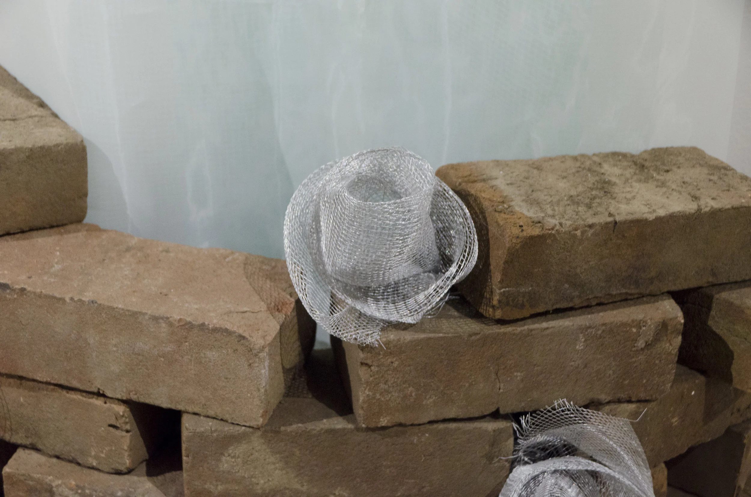   Bubbly  (Detail)   2018   Plastic, fabric, mesh, brick, and wire mesh    