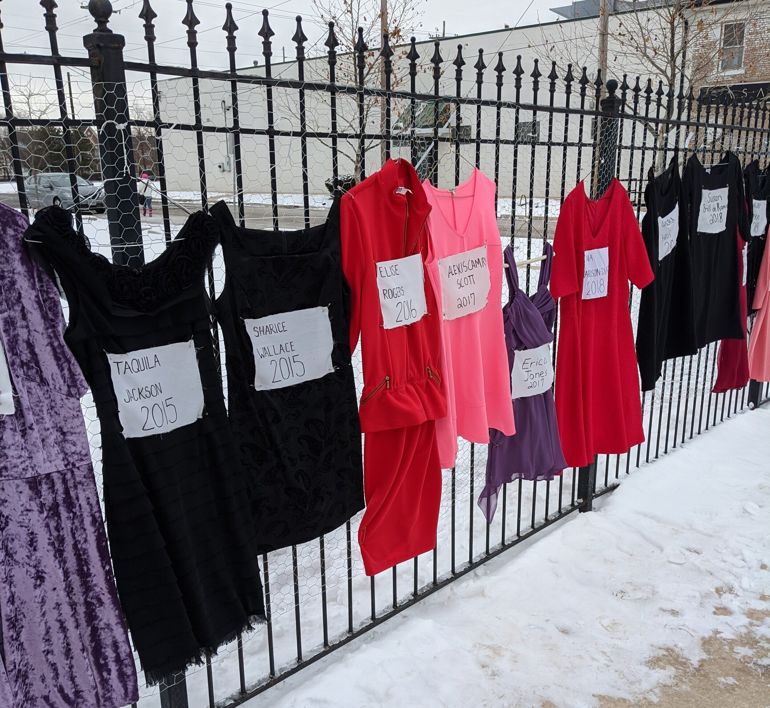   Remember Her, Peoria!   Collaborative Public Installation honoring the missing and murdered women of Peoria from 1993-2019  Dresses, fabric, fabric markers, hangers  2020   In collaboration with community leaders and activists:    Susan O’Neal    N