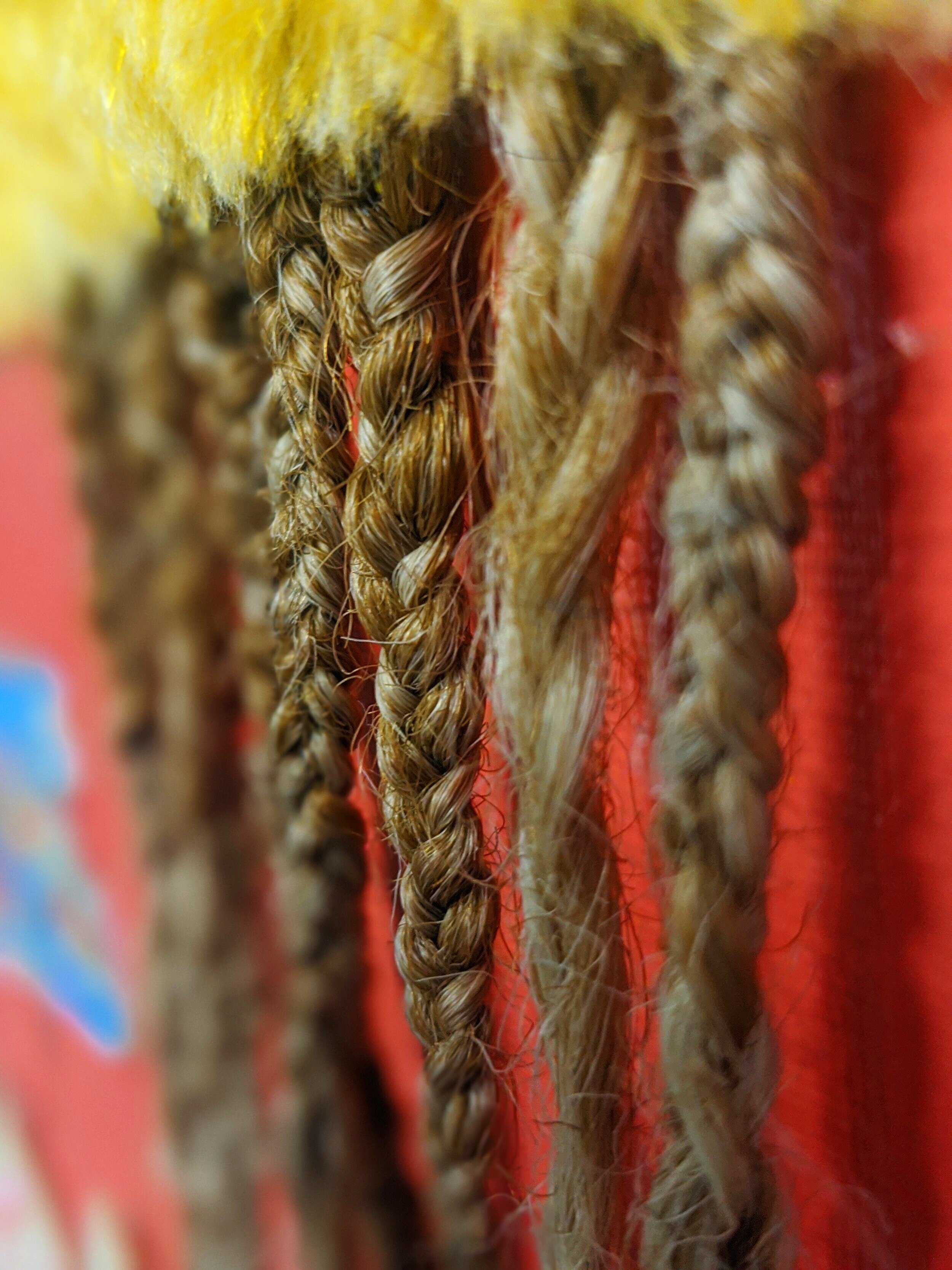   Porch Braids (Detail)   2020  Faux fur, jewelry, hair, washi tape, wood, acrylic, and pastel on canvas 