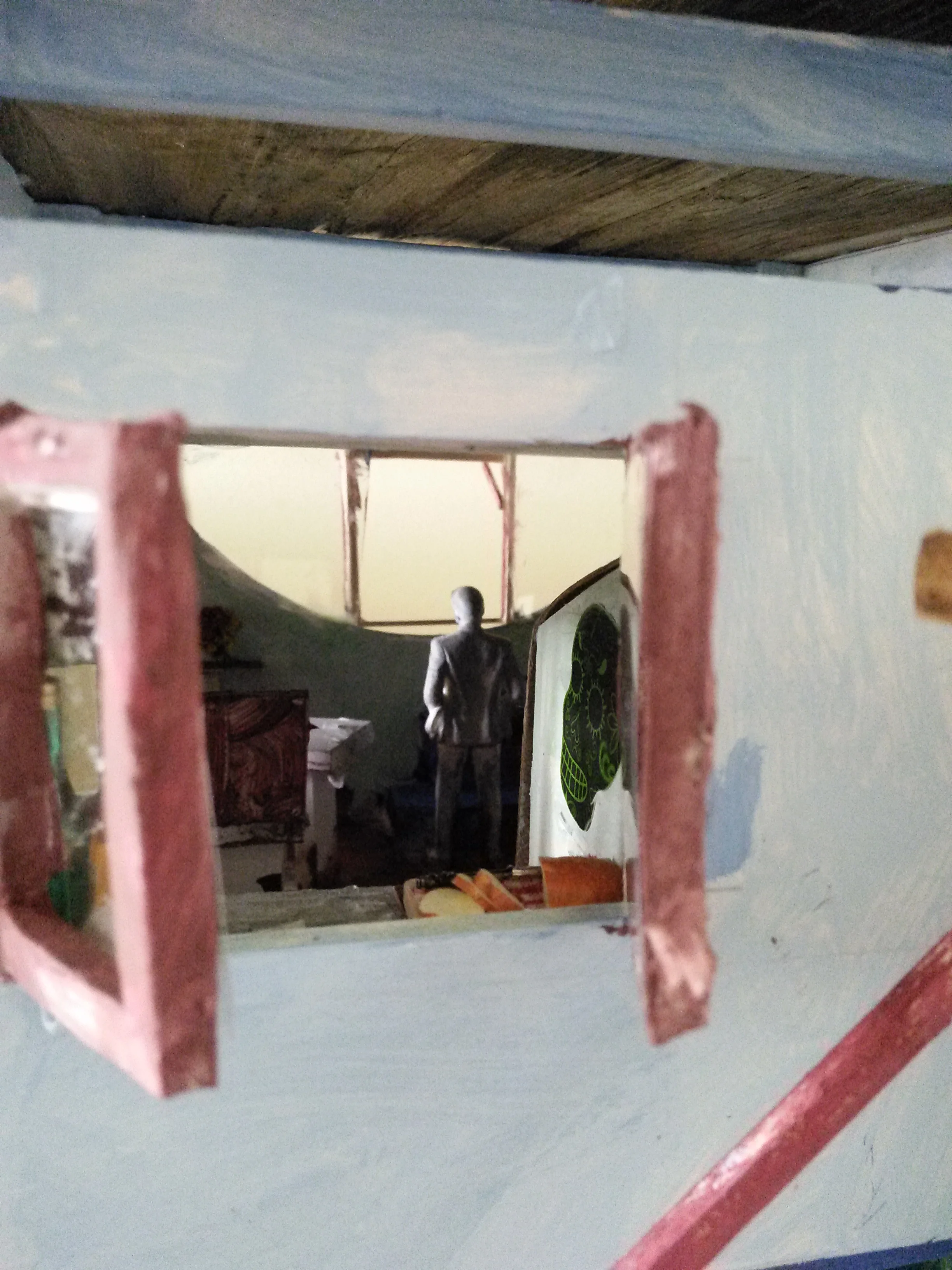 <font color=#00000>VIEW FROM INTERIOR OUT TO OCEAN , THROUGH HALF MOON WINDOW.</font>