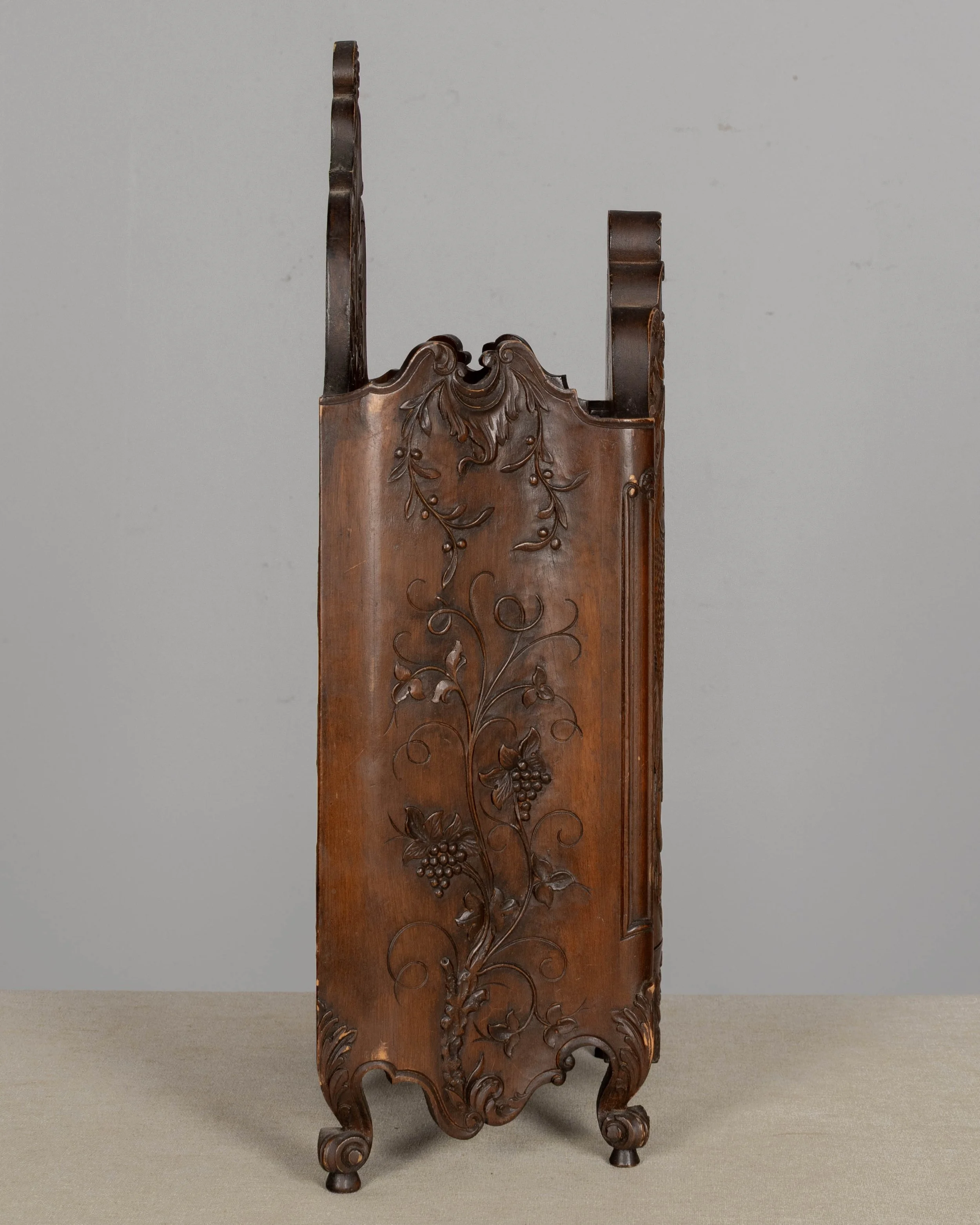 19th century French fariniere made of walnut with nicely detailed hand-carved decorative motifs: