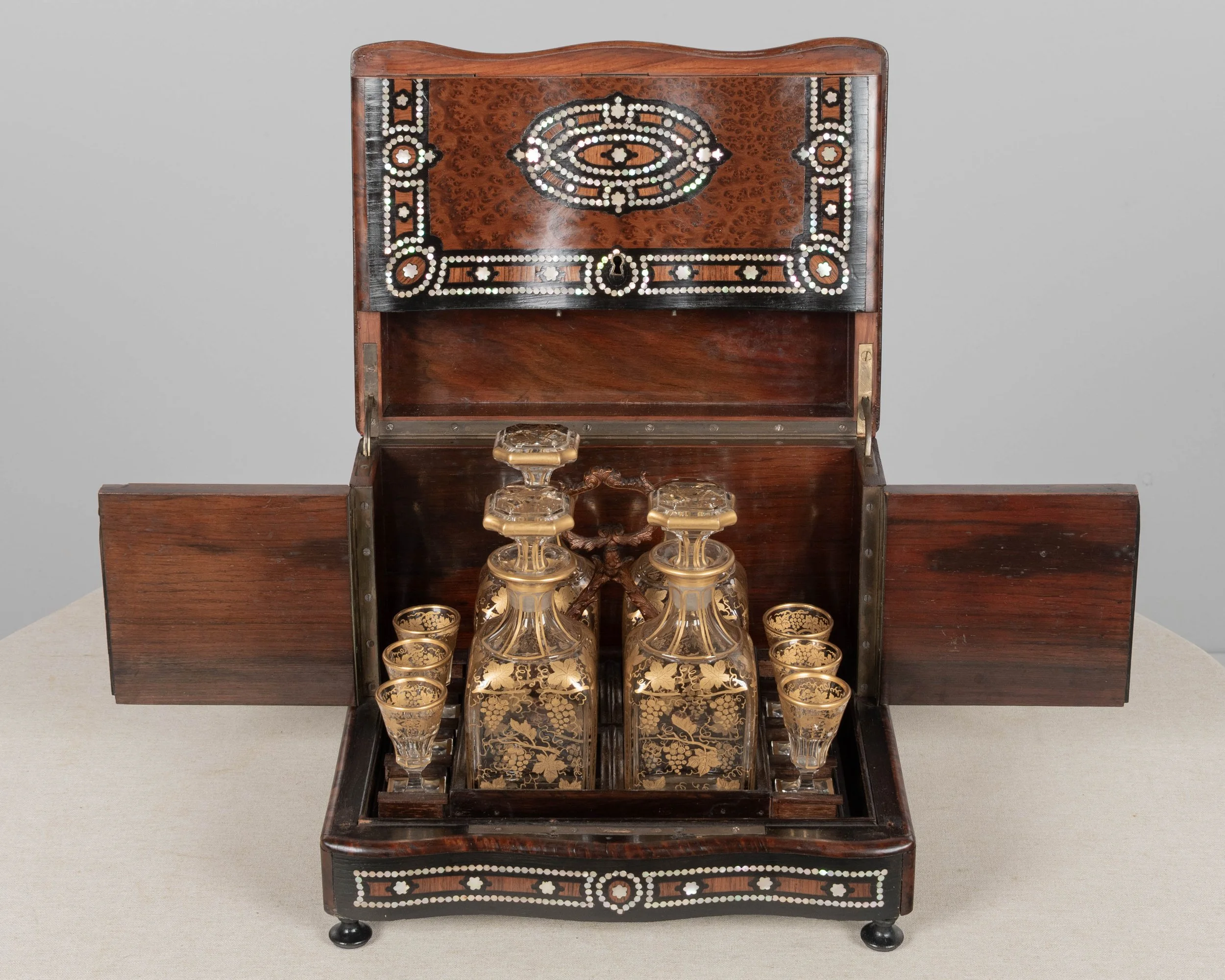 A fine 19th century French Napoleon III tantalus, or cave à liqueur, in the style of Charles-Guillaume Diehl