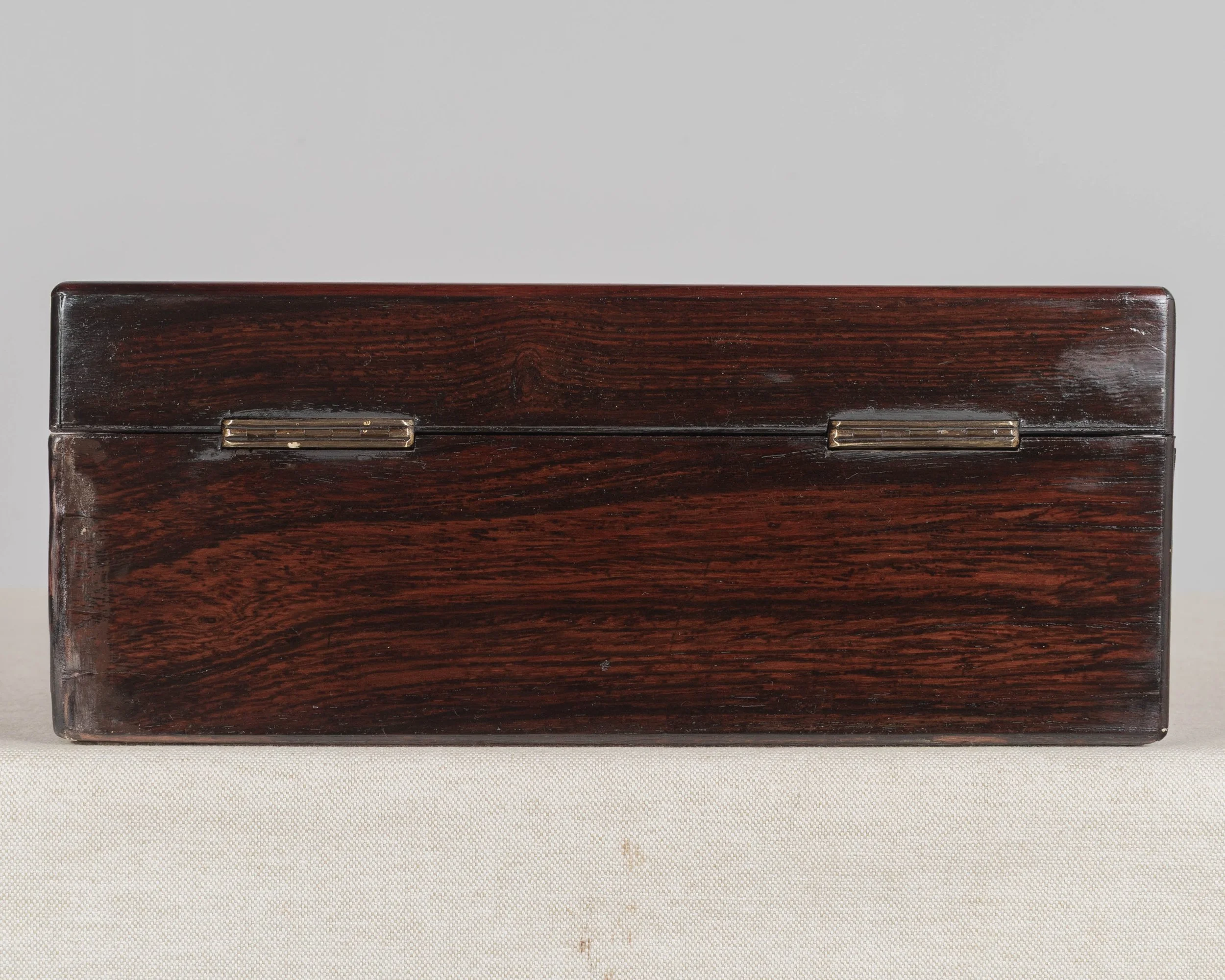 A 19th Century French Napoleon III marquetry box made of rosewood veneer with fine mother-of-pearl and brass inlay.