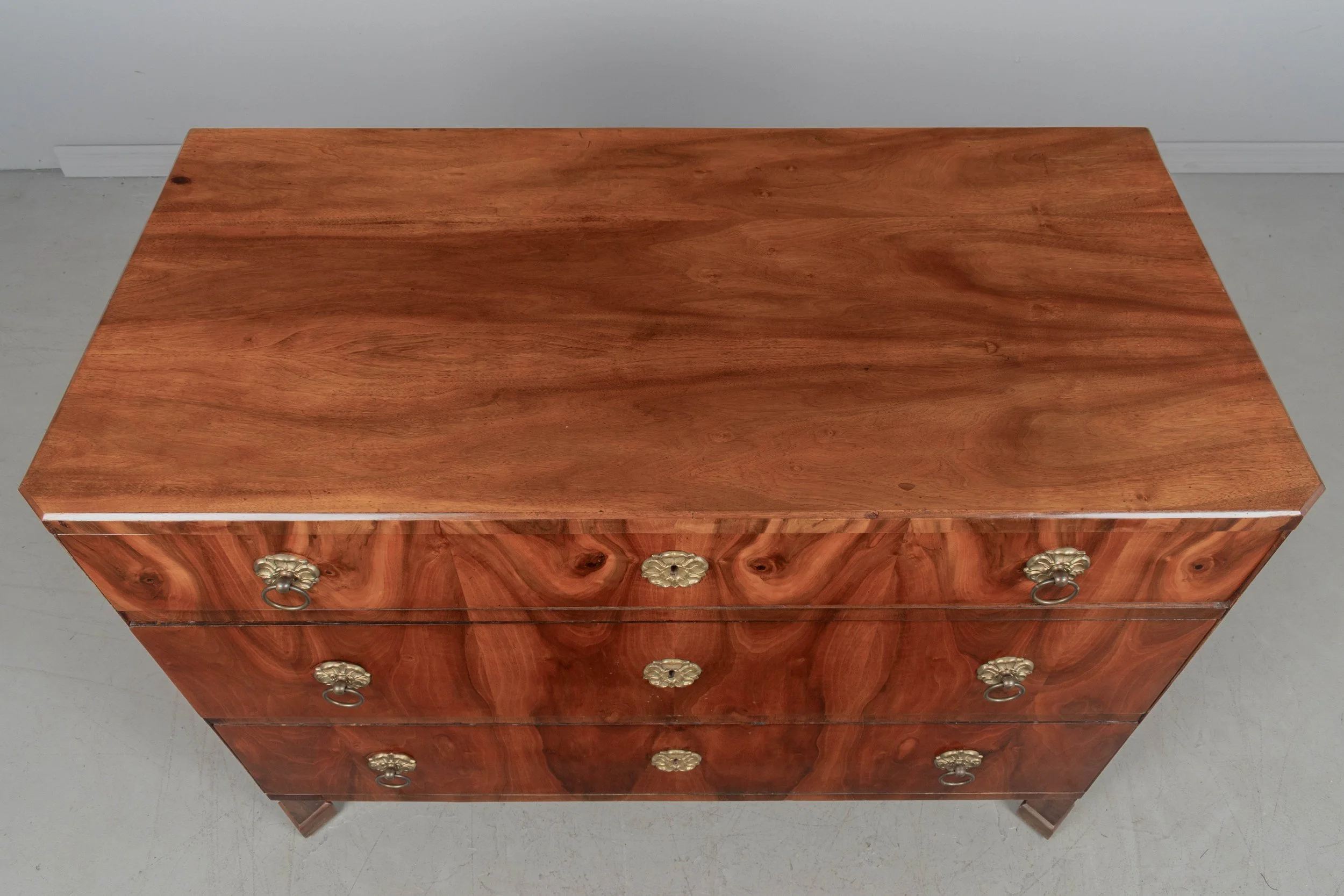 A fine 19th century Biedermeier commode from Austria made with beautifully patterned book matched veneer of walnut over pine.
