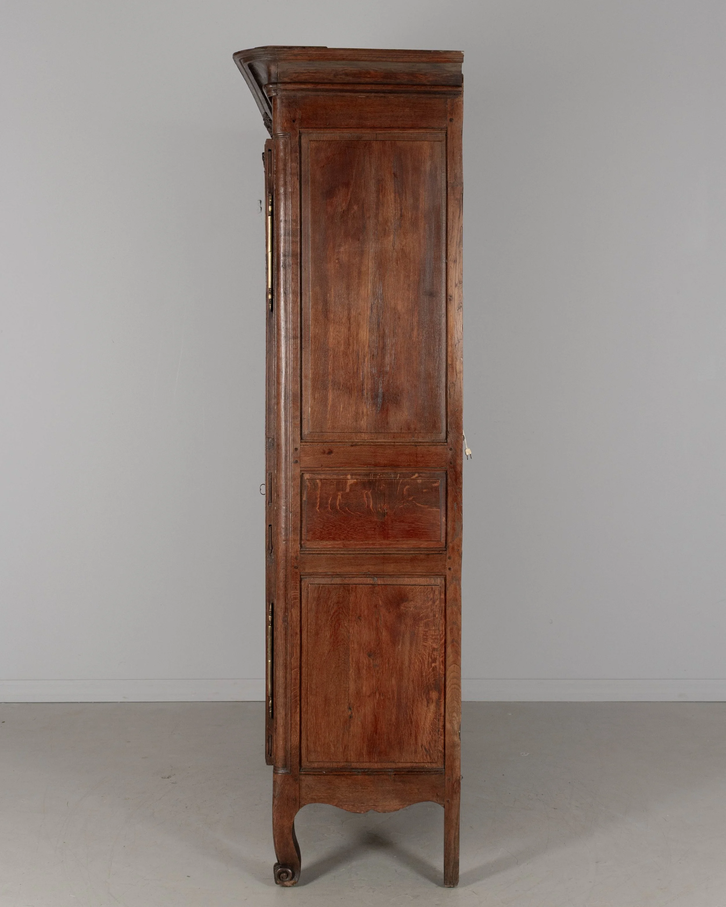 A 19th century Louis XV style Country French armoire, or display cabinet from Normandy.