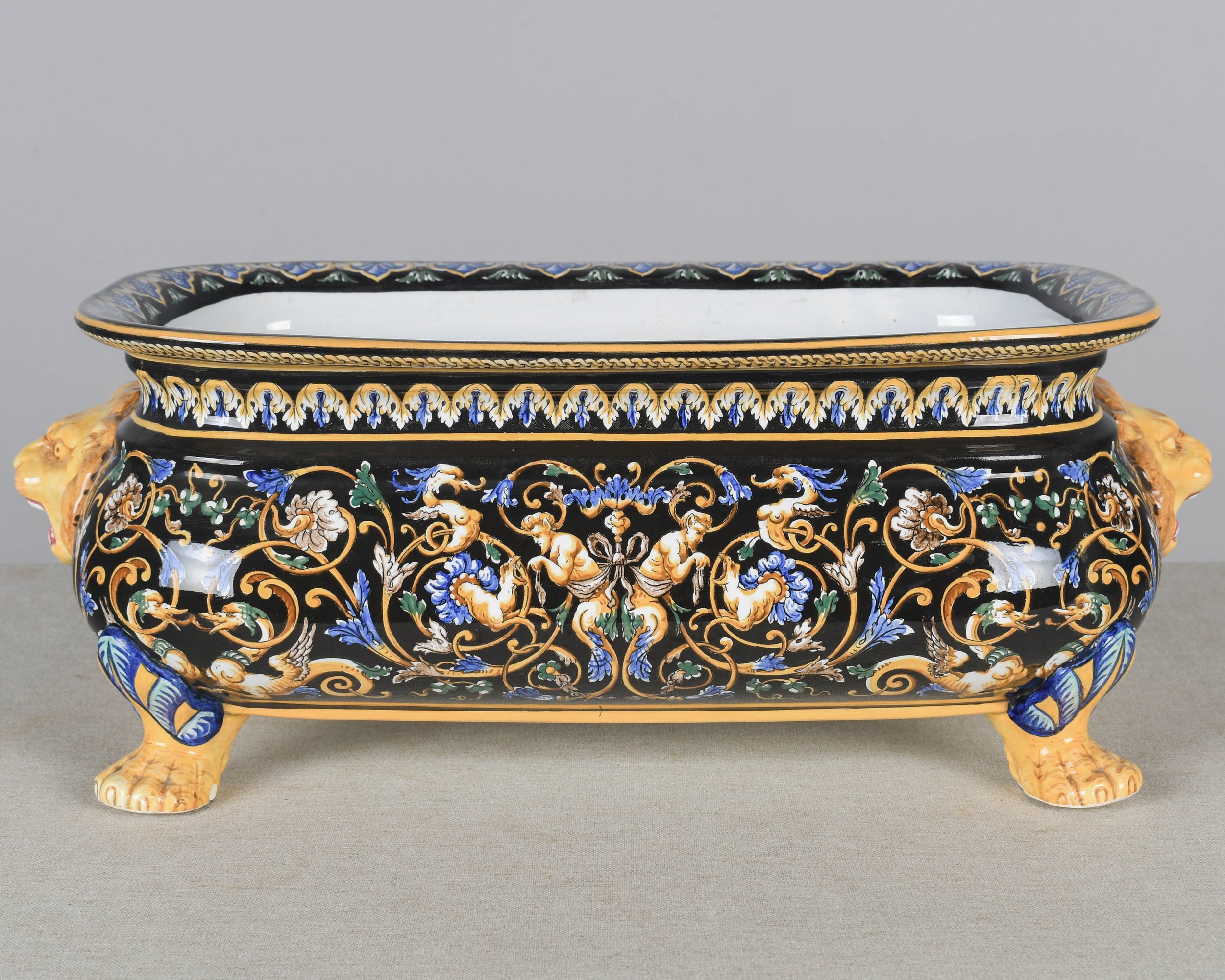 A late 19th century French Gien faience ceramic jardinière, or shallow footed centerpiece bowl.