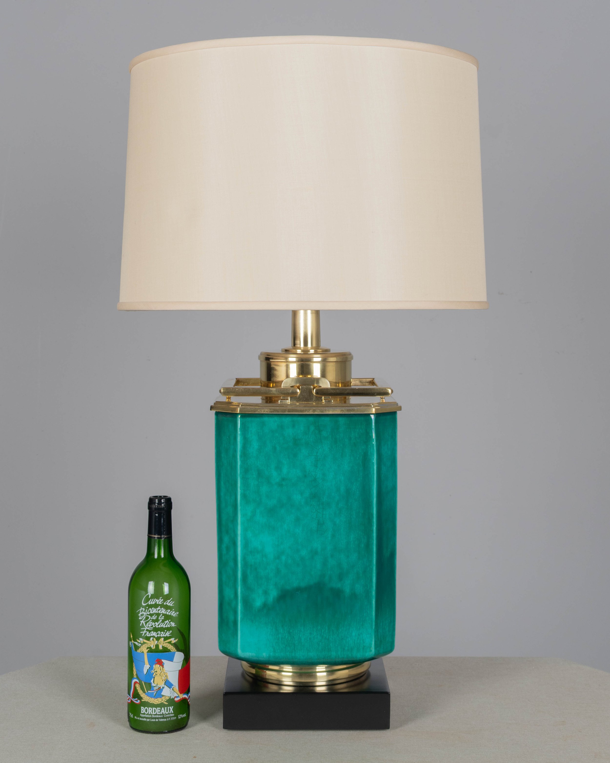 A Mid Century table lamp by Edwin Cole for Stiffel. Large octagonal deeply saturated heavy glazed ceramic body in beautiful shade of turquoise,