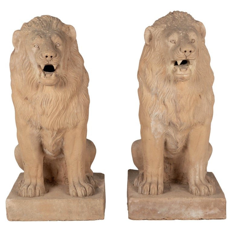 A pair of early 20th Century terracotta garden lions