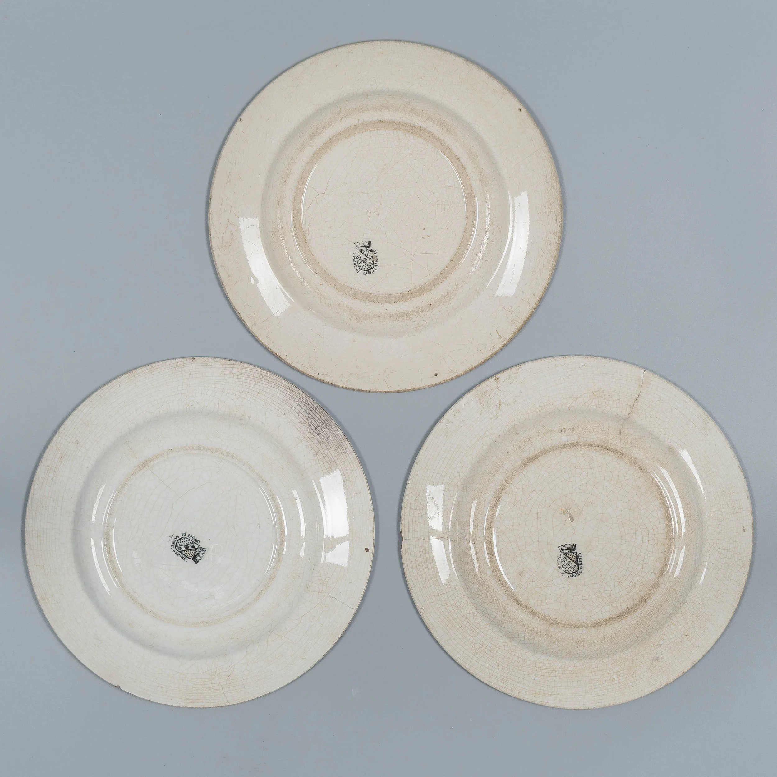 A set of three 19th Century French glazed faience plates made by Sarreguemines