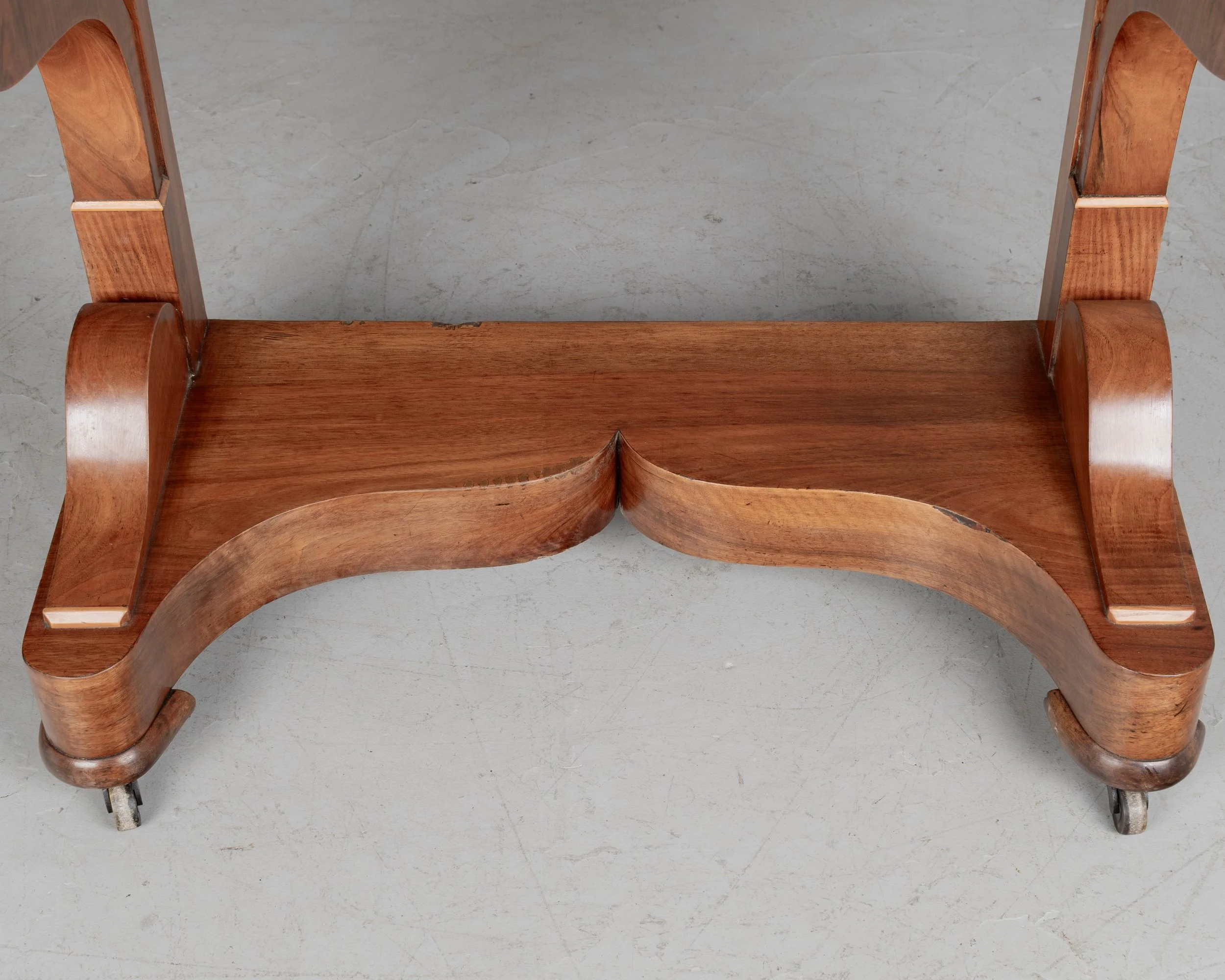 A 19th century French Louis-Philippe console made of solid walnut and veneer of walnut