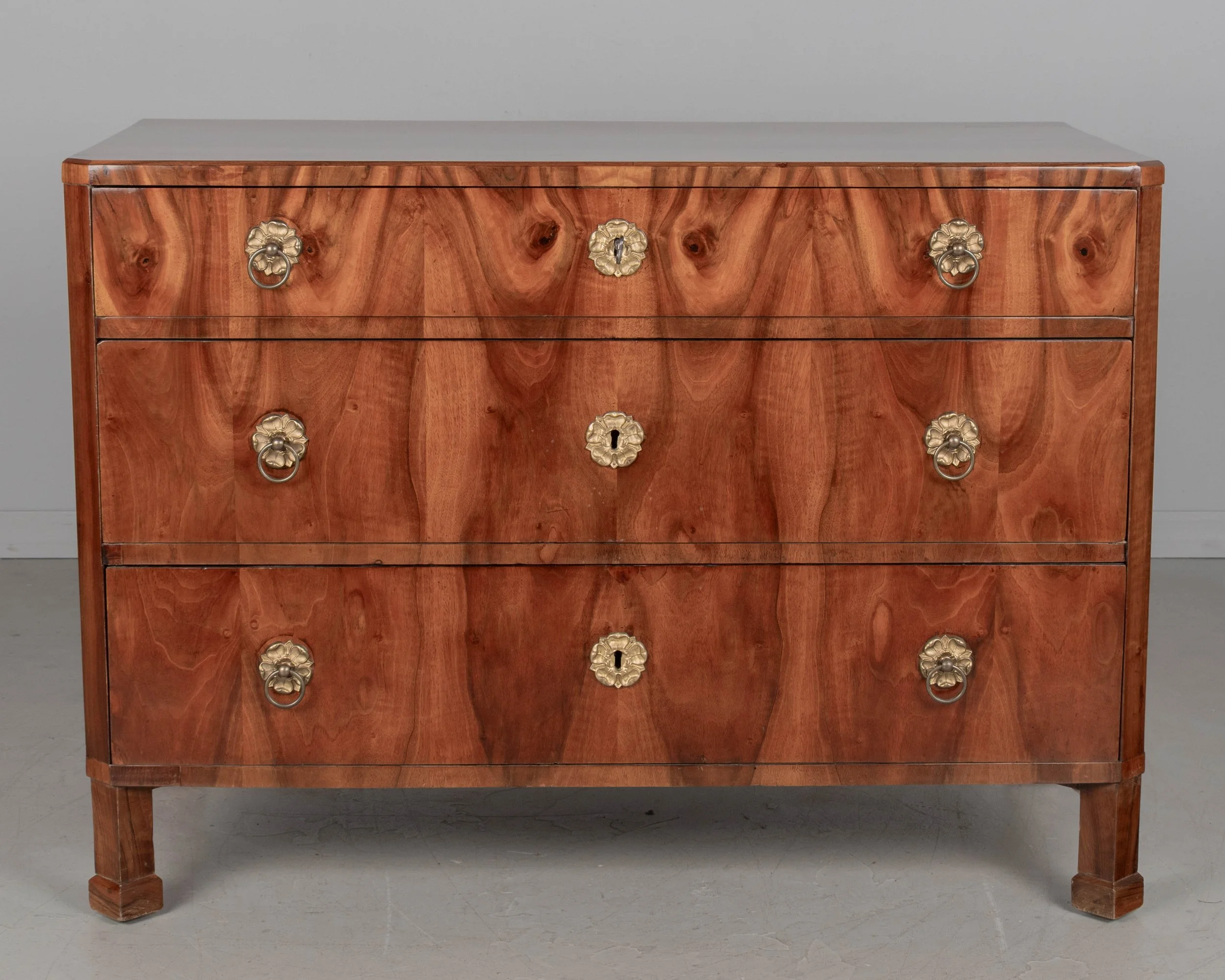 A fine 19th century Biedermeier commode from Austria made with beautifully patterned book matched veneer of walnut over pine.